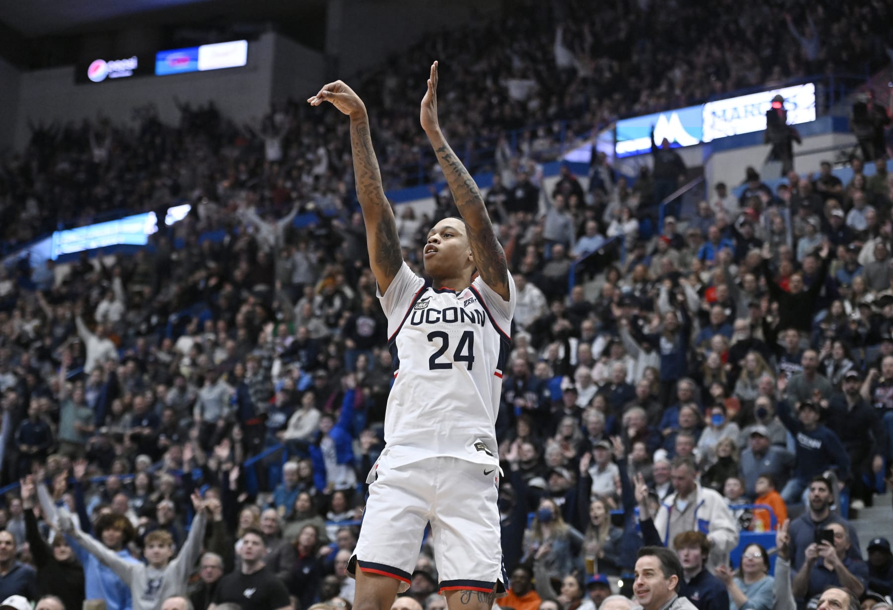 UConn's Jordan Hawkins (24) shoots in the second half of an NCAA college basketball game against Villanova, Wednesday, Dec. 28, 2022, in Hartford, Conn. (AP Photo/Jessica Hill)