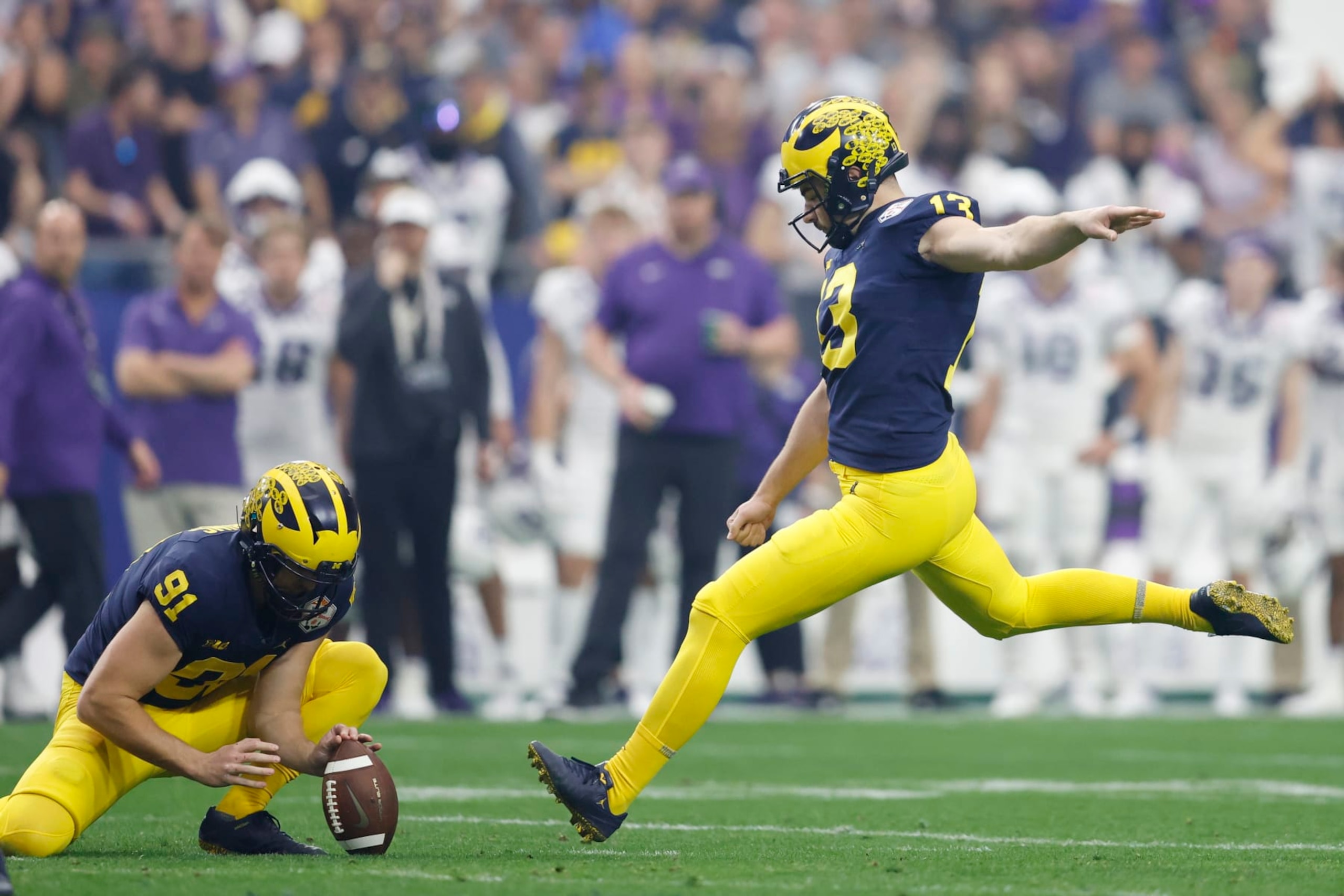 GLENDALE, ARIZONA - DECEMBER 31: Jake Moody #13 of the Michigan Wolverines kicks a field goal during the second quarter against the TCU Horned Frogs in the Vrbo Fiesta Bowl at State Farm Stadium on December 31, 2022 in Glendale, Arizona. (Photo by Chris Coduto/Getty Images) GLENDALE, ARIZONA - DECEMBER 31: Jake Moody #13 of the Michigan Wolverines kicks a field goal during the second quarter against the TCU Horned Frogs in the Vrbo Fiesta Bowl at State Farm Stadium on December 31, 2022 in Glendale, Arizona. (Photo by Chris Coduto/Getty Images)