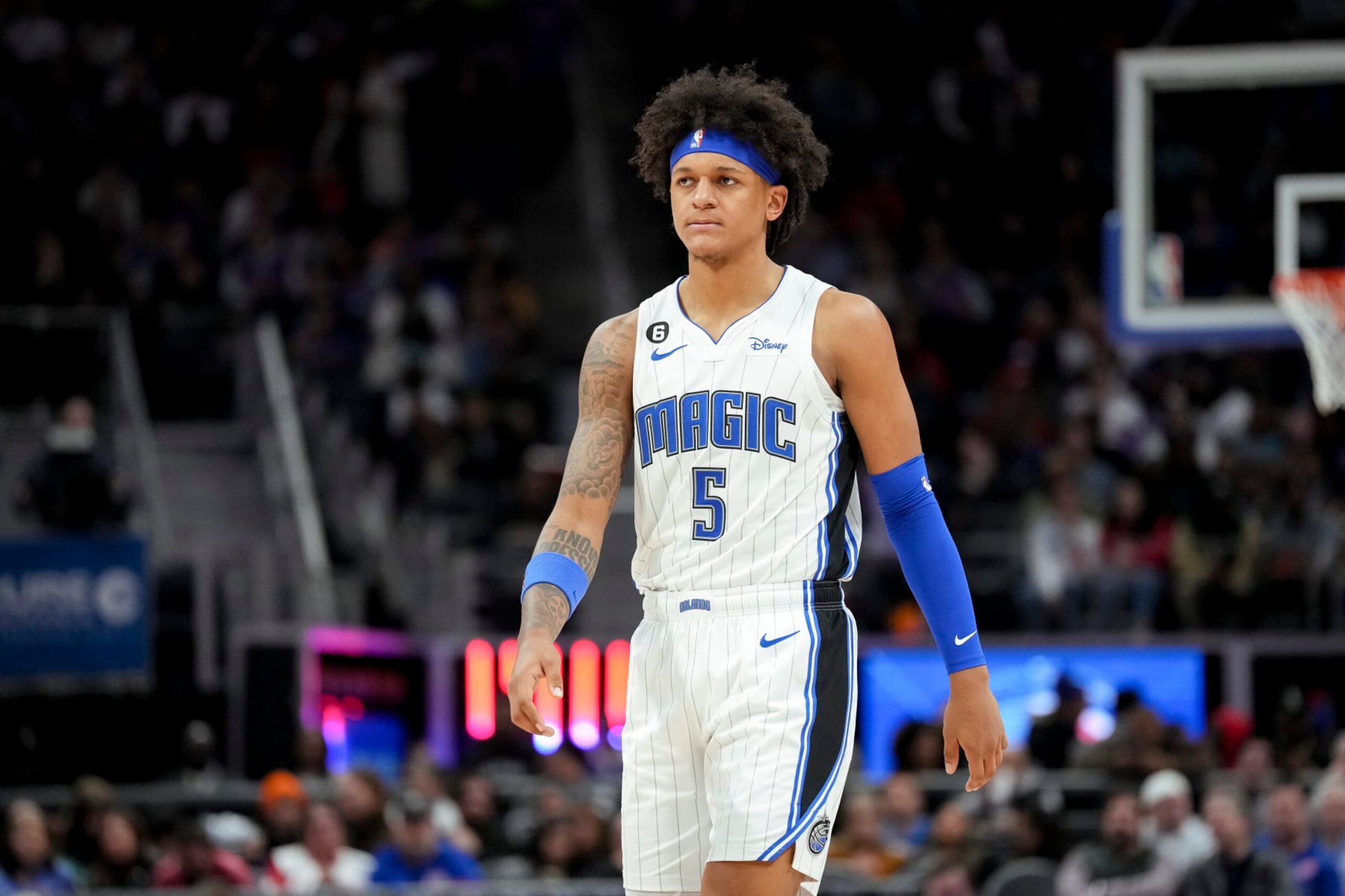 DETROIT, MICHIGAN - DECEMBER 28: Paolo Banchero #5 of the Orlando Magic looks on against the Detroit Pistons at Little Caesars Arena on December 28, 2022 in Detroit, Michigan. NOTE TO USER: User expressly acknowledges and agrees that, by downloading and or using this photograph, User is consenting to the terms and conditions of the Getty Images License Agreement. (Photo by Nic Antaya/Getty Images) DETROIT, MICHIGAN - DECEMBER 28: Paolo Banchero #5 of the Orlando Magic looks on against the Detroit Pistons at Little Caesars Arena on December 28, 2022 in Detroit, Michigan. NOTE TO USER: User expressly acknowledges and agrees that, by downloading and or using this photograph, User is consenting to the terms and conditions of the Getty Images License Agreement. (Photo by Nic Antaya/Getty Images)