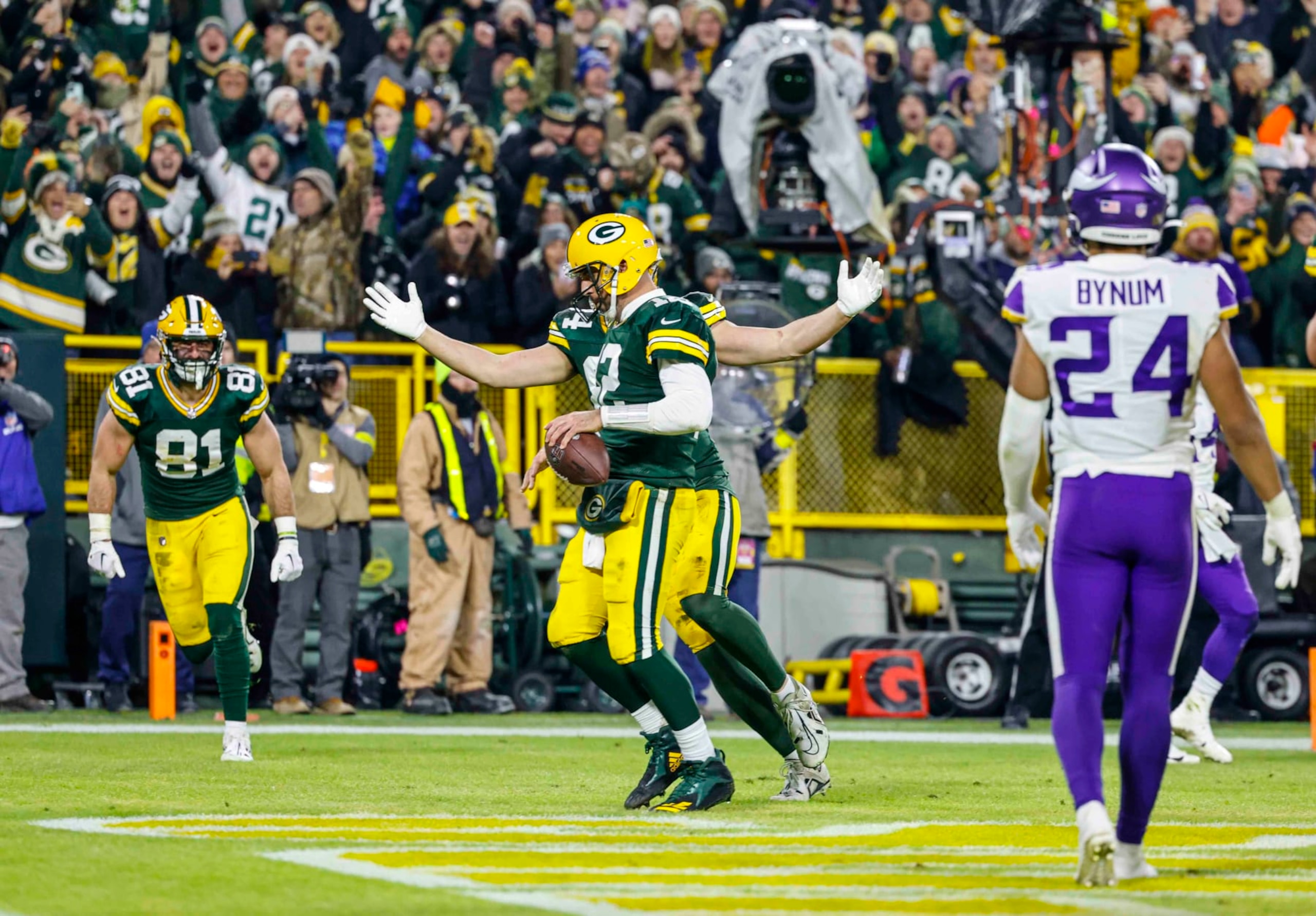 Green Bay Packers quarterback Aaron Rodgers (12) runs in for a touchdown during an NFL football game against the Minnesota Vikings Sunday, Jan. 1, 2023, in Green Bay, Wis. (AP Photo/Jeffrey Phelps) Green Bay Packers quarterback Aaron Rodgers (12) runs in for a touchdown during an NFL football game against the Minnesota Vikings Sunday, Jan. 1, 2023, in Green Bay, Wis. (AP Photo/Jeffrey Phelps)