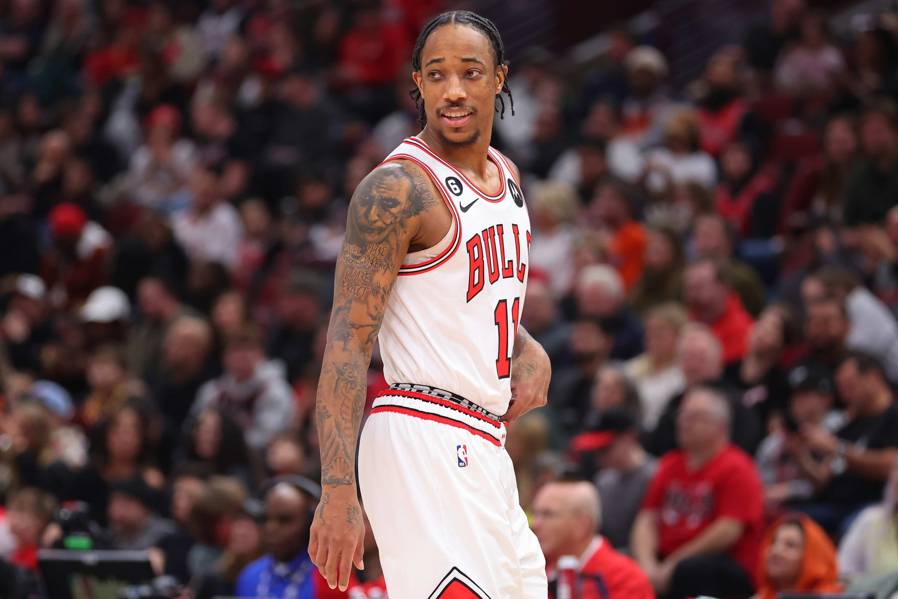 CHICAGO, ILLINOIS - DECEMBER 31: DeMar DeRozan #11 of the Chicago Bulls looks on prior to the game against the Cleveland Cavaliers during the first half at United Center on December 31, 2022 in Chicago, Illinois. NOTE TO USER: User expressly acknowledges and agrees that, by downloading and or using this photograph, User is consenting to the terms and conditions of the Getty Images License Agreement. (Photo by Michael Reaves/Getty Images)