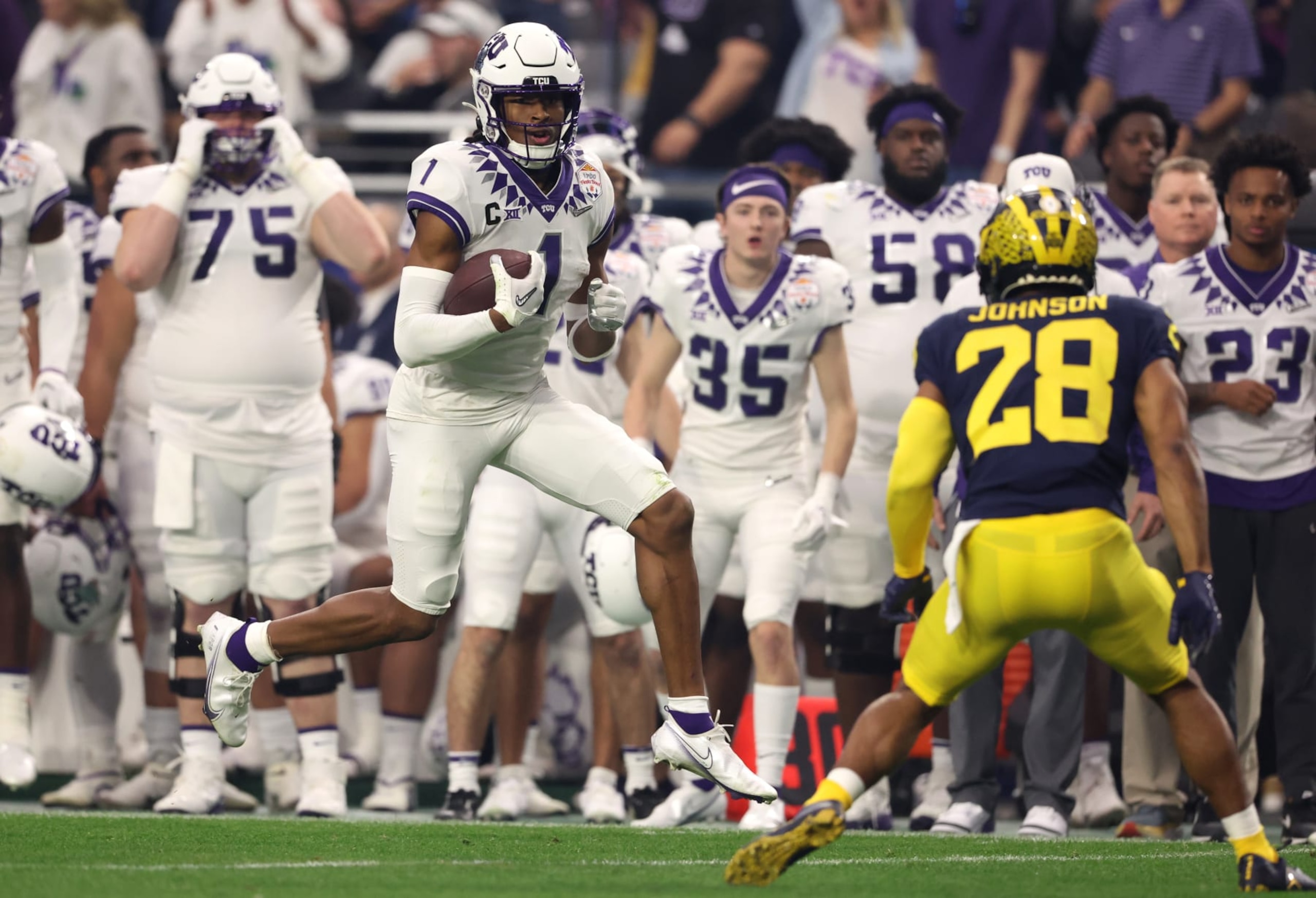 GLENDALE, ARIZONA - DECEMBER 31: Quentin Johnston #1 of the TCU Horned Frogs runs after catching a pass during the second quarter in the Vrbo Fiesta Bowl at State Farm Stadium on December 31, 2022 in Glendale, Arizona. (Photo by Christian Petersen/Getty Images)
