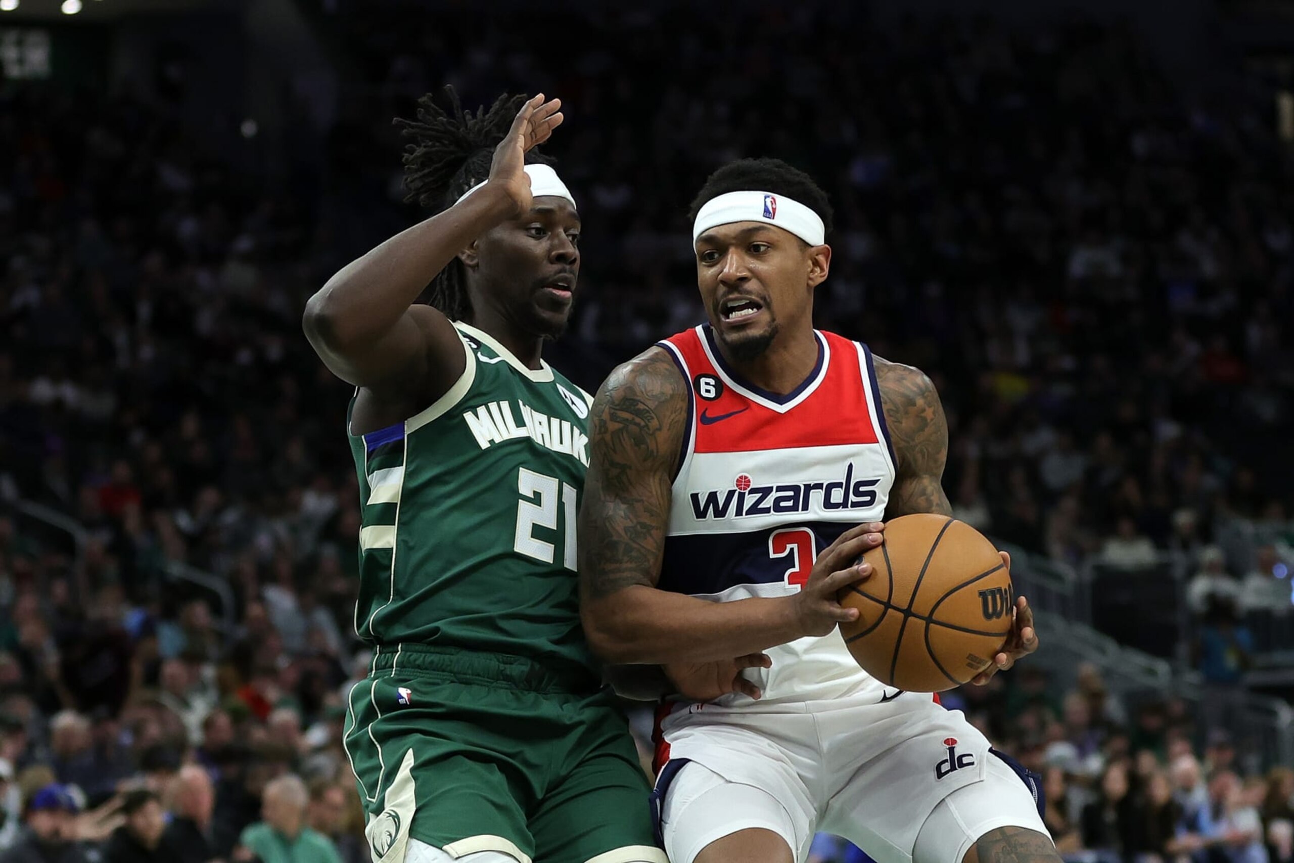MILWAUKEE, WISCONSIN - JANUARY 03: Bradley Beal #3 of the Washington Wizards is defended by Jrue Holiday #21 of the Milwaukee Bucks during the first half of a game at Fiserv Forum on January 03, 2023 in Milwaukee, Wisconsin. NOTE TO USER: User expressly acknowledges and agrees that, by downloading and or using this photograph, User is consenting to the terms and conditions of the Getty Images License Agreement. (Photo by Stacy Revere/Getty Images) MILWAUKEE, WISCONSIN - JANUARY 03: Bradley Beal #3 of the Washington Wizards is defended by Jrue Holiday #21 of the Milwaukee Bucks during the first half of a game at Fiserv Forum on January 03, 2023 in Milwaukee, Wisconsin. NOTE TO USER: User expressly acknowledges and agrees that, by downloading and or using this photograph, User is consenting to the terms and conditions of the Getty Images License Agreement. (Photo by Stacy Revere/Getty Images)