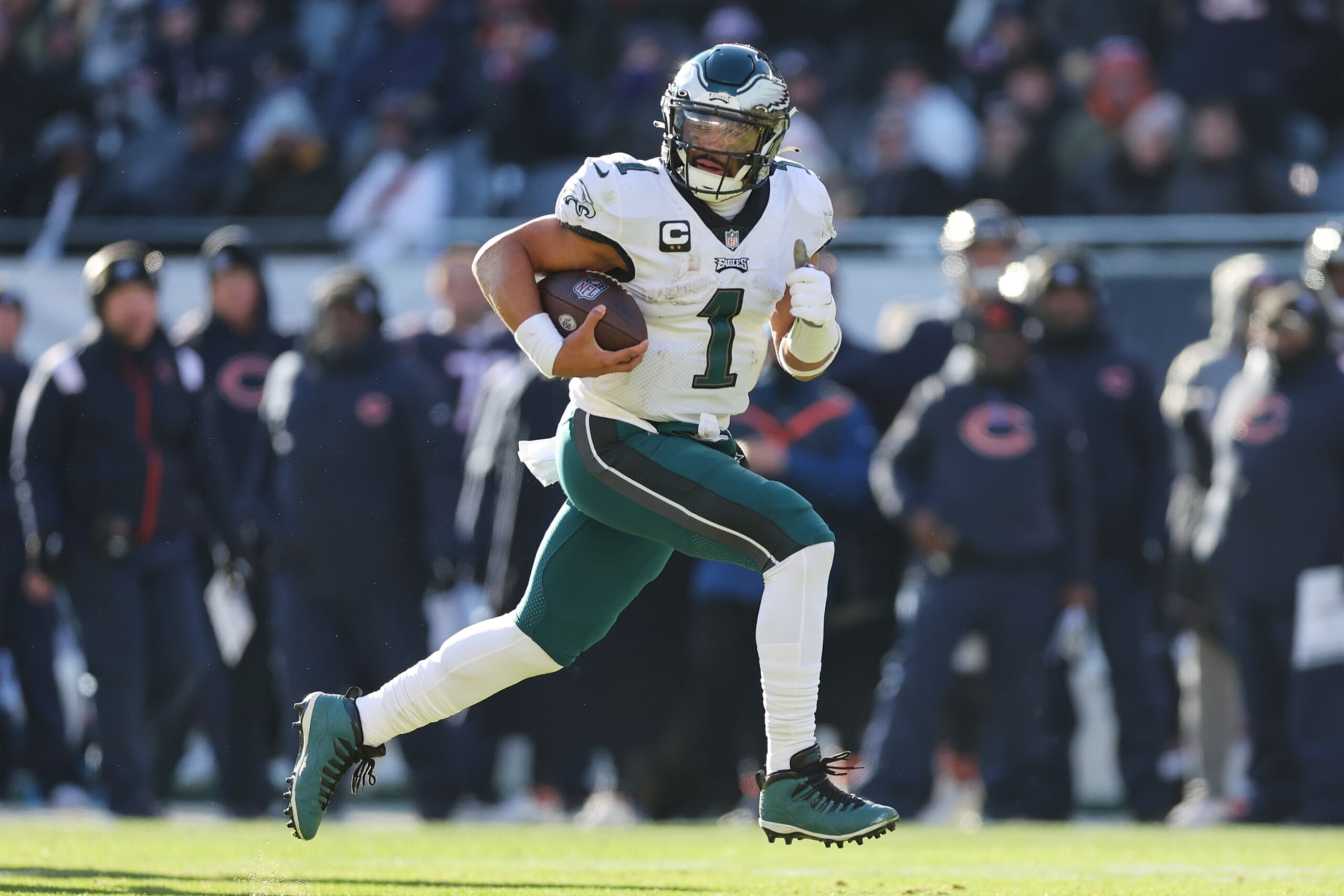 CHICAGO, ILLINOIS - DECEMBER 18: Jalen Hurts #1 of the Philadelphia Eagles runs for a touchdown against the Chicago Bears during the second quarterat Soldier Field on December 18, 2022 in Chicago, Illinois. (Photo by Michael Reaves/Getty Images)