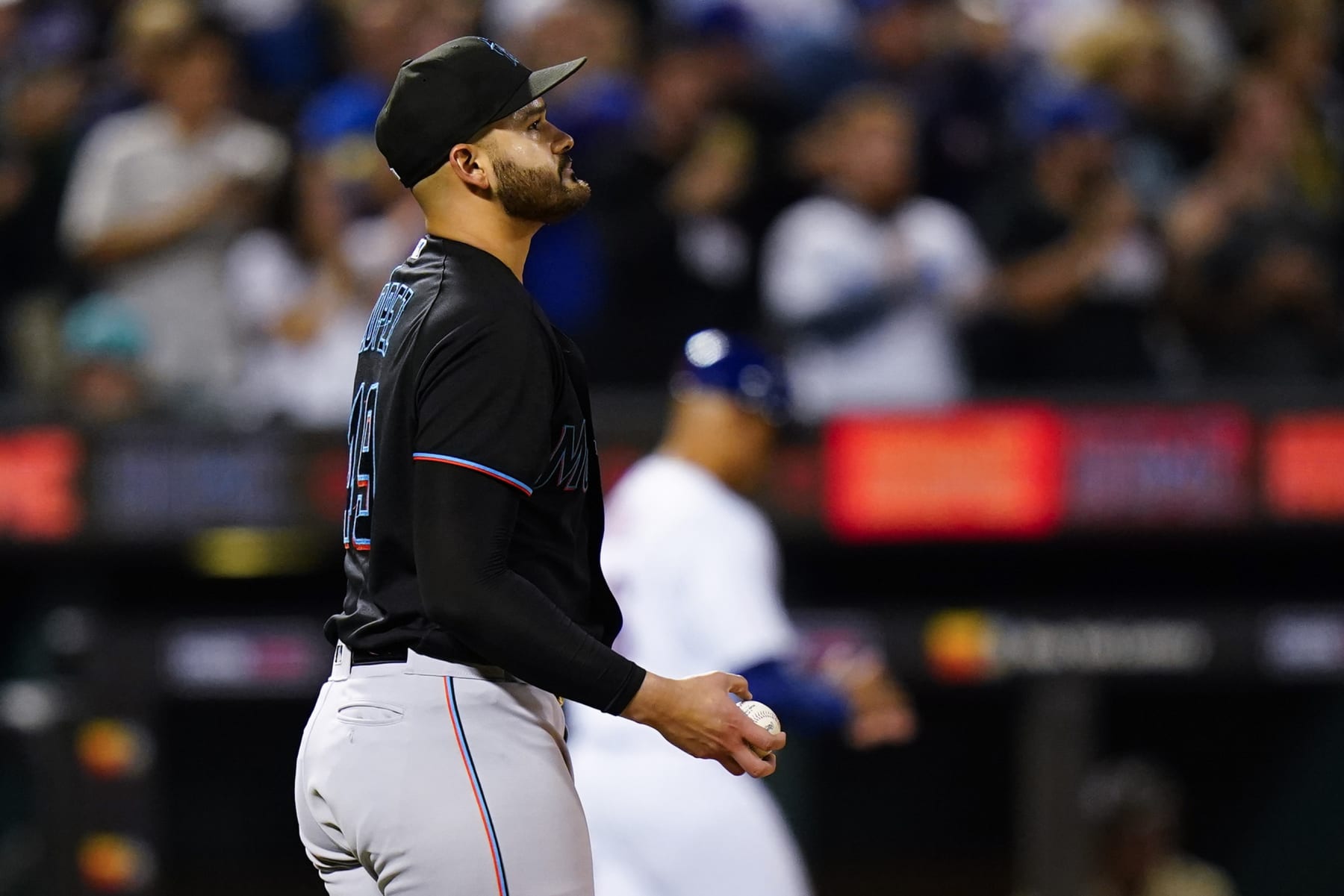 Miami Marlins starting pitcher Pablo Lopez looks at a replay after New York Mets' Pete Alonso hit a three-run home run during the fourth inning of a baseball game Tuesday, Sept. 27, 2022, in New York. (AP Photo/Frank Franklin II)