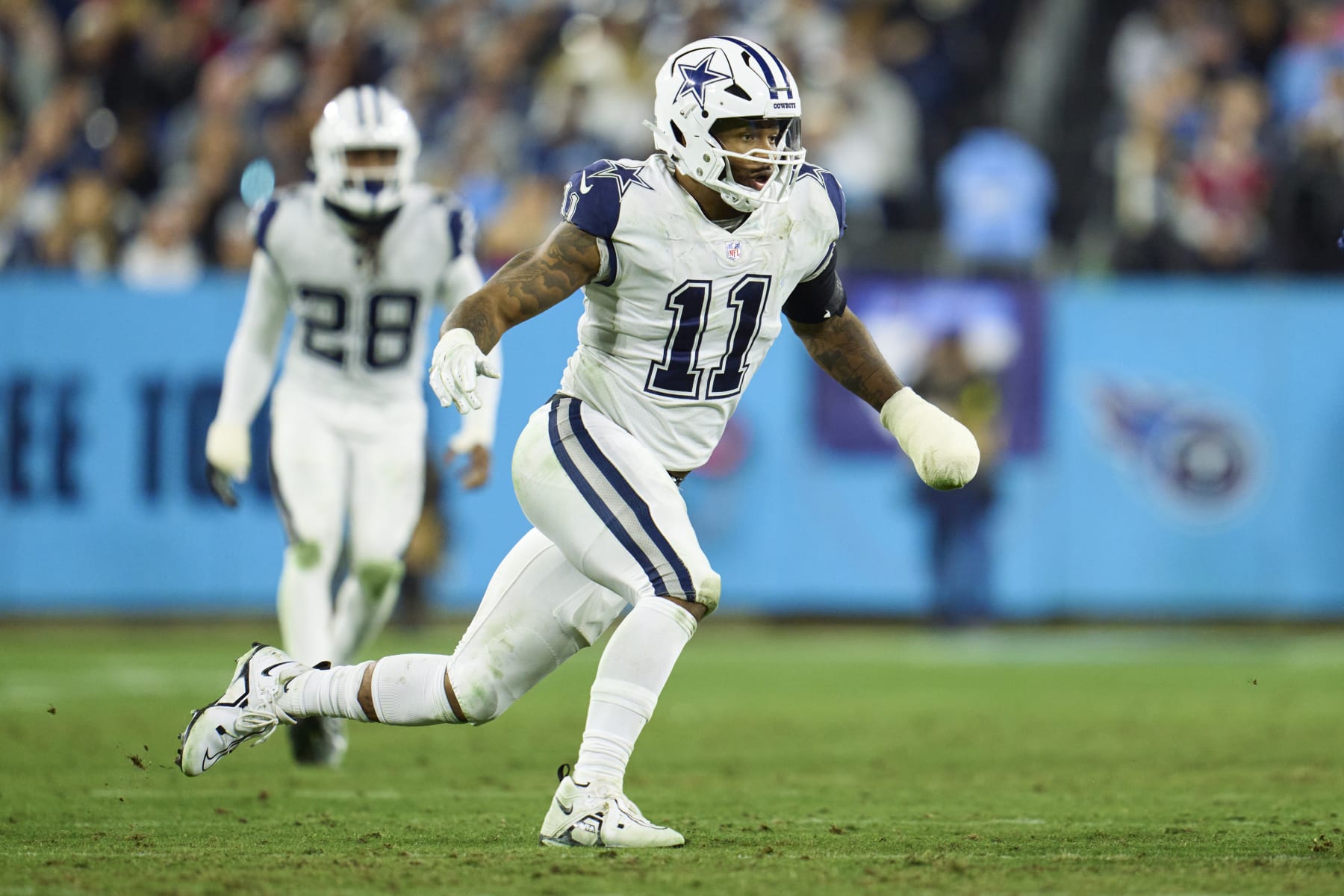 NASHVILLE, TN - DECEMBER 29: Micah Parsons #11 of the Dallas Cowboys defends against the Tennessee Titans during the second half at Nissan Stadium on December 29, 2022 in Nashville, Tennessee. (Photo by Cooper Neill/Getty Images)