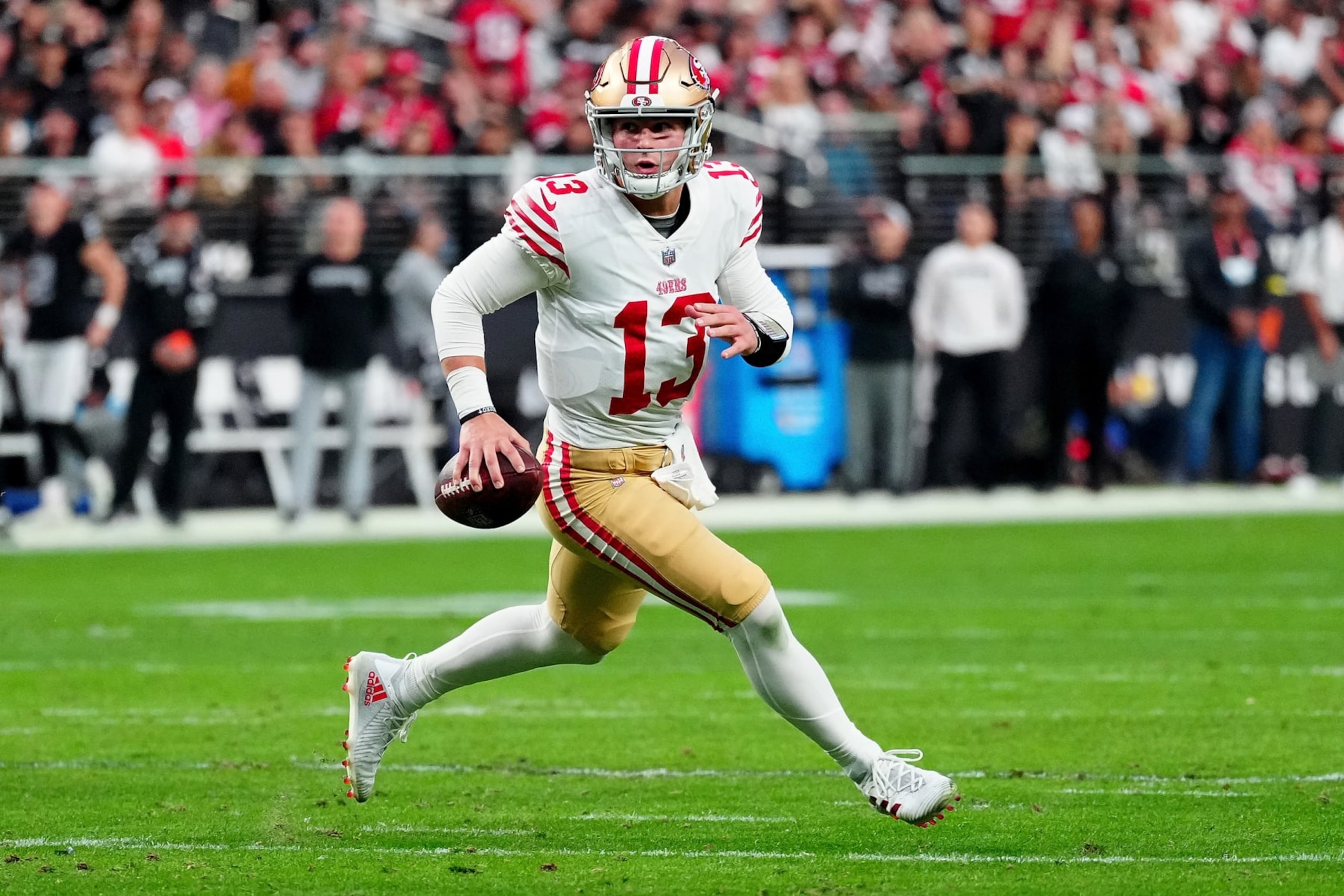 LAS VEGAS, NEVADA - JANUARY 01: Brock Purdy #13 of the San Francisco 49ers runs against the Las Vegas Raiders during the second quarter at Allegiant Stadium on January 01, 2023 in Las Vegas, Nevada. (Photo by Jeff Bottari/Getty Images)