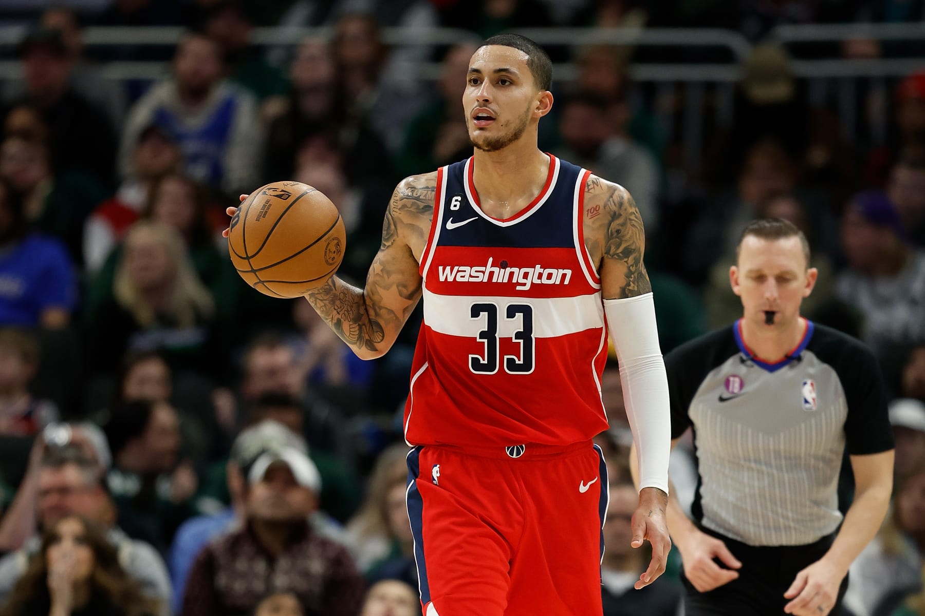 MILWAUKEE, WISCONSIN - JANUARY 01: Kyle Kuzma #33 of the Washington Wizards dribbles up court during the first half of the game against the Milwaukee Bucks at Fiserv Forum on January 01, 2023 in Milwaukee, Wisconsin. NOTE TO USER: User expressly acknowledges and agrees that, by downloading and or using this photograph, User is consenting to the terms and conditions of the Getty Images License Agreement. (Photo by John Fisher/Getty Images)