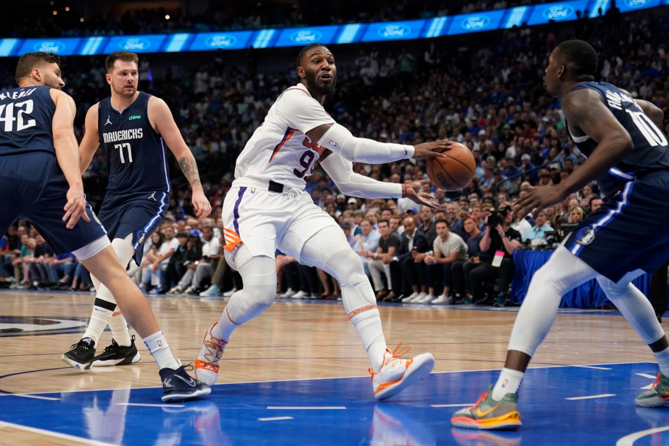 Phoenix Suns forward Jae Crowder (99) drives to the basket against Dallas Mavericks forward Dorian Finney-Smith (10) during the first half of Game 6 of an NBA basketball second-round playoff series, Thursday, May 12, 2022, in Dallas. (AP Photo/Tony Gutierrez) Phoenix Suns forward Jae Crowder (99) drives to the basket against Dallas Mavericks forward Dorian Finney-Smith (10) during the first half of Game 6 of an NBA basketball second-round playoff series, Thursday, May 12, 2022, in Dallas. (AP Photo/Tony Gutierrez)