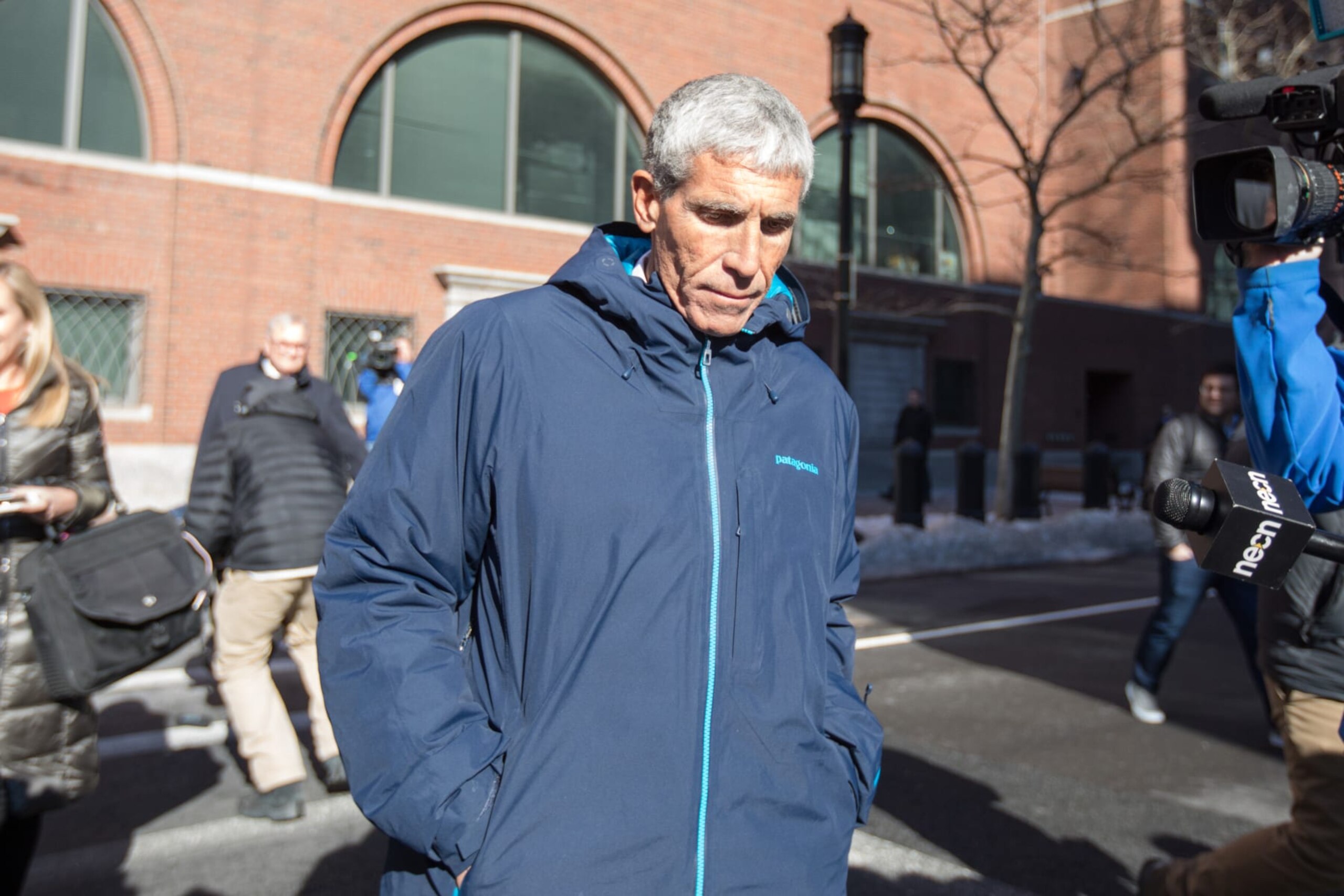 BOSTON, MA - MARCH 12:  William "Rick" Singer leaves Boston Federal Court after being charged with racketeering conspiracy, money laundering conspiracy, conspiracy to defraud the United States, and obstruction of justice on March 12, 2019 in Boston, Massachusetts. Singer is among several charged in alleged college admissions scam.  (Photo by Scott Eisen/Getty Images)