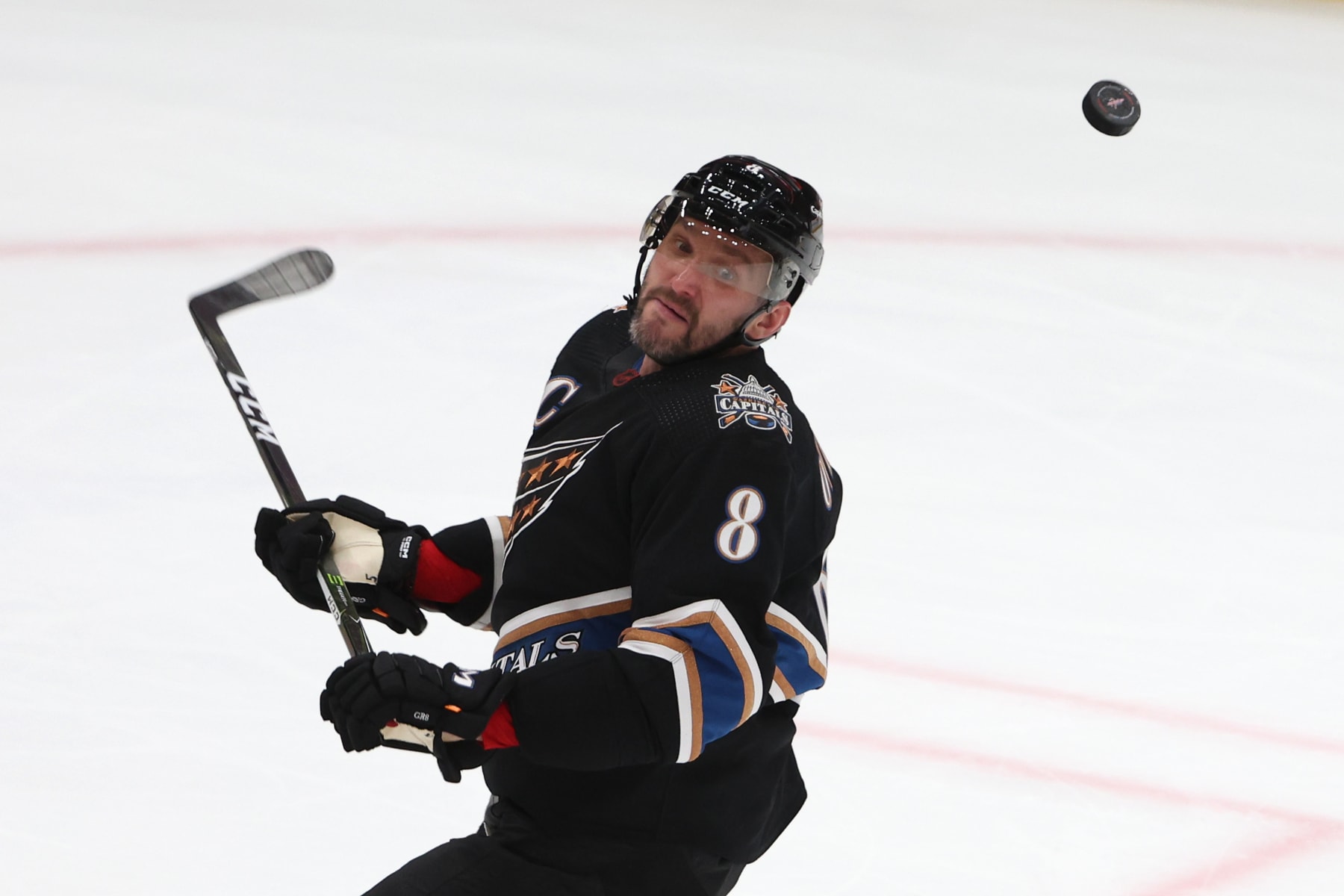 WASHINGTON, DC - JANUARY 03: Alex Ovechkin #8 of the Washington Capitals cannot control a loose puck against the Buffalo Sabres during the third period at Capital One Arena on January 3, 2023 in Washington, DC. (Photo by Patrick Smith/Getty Images)
