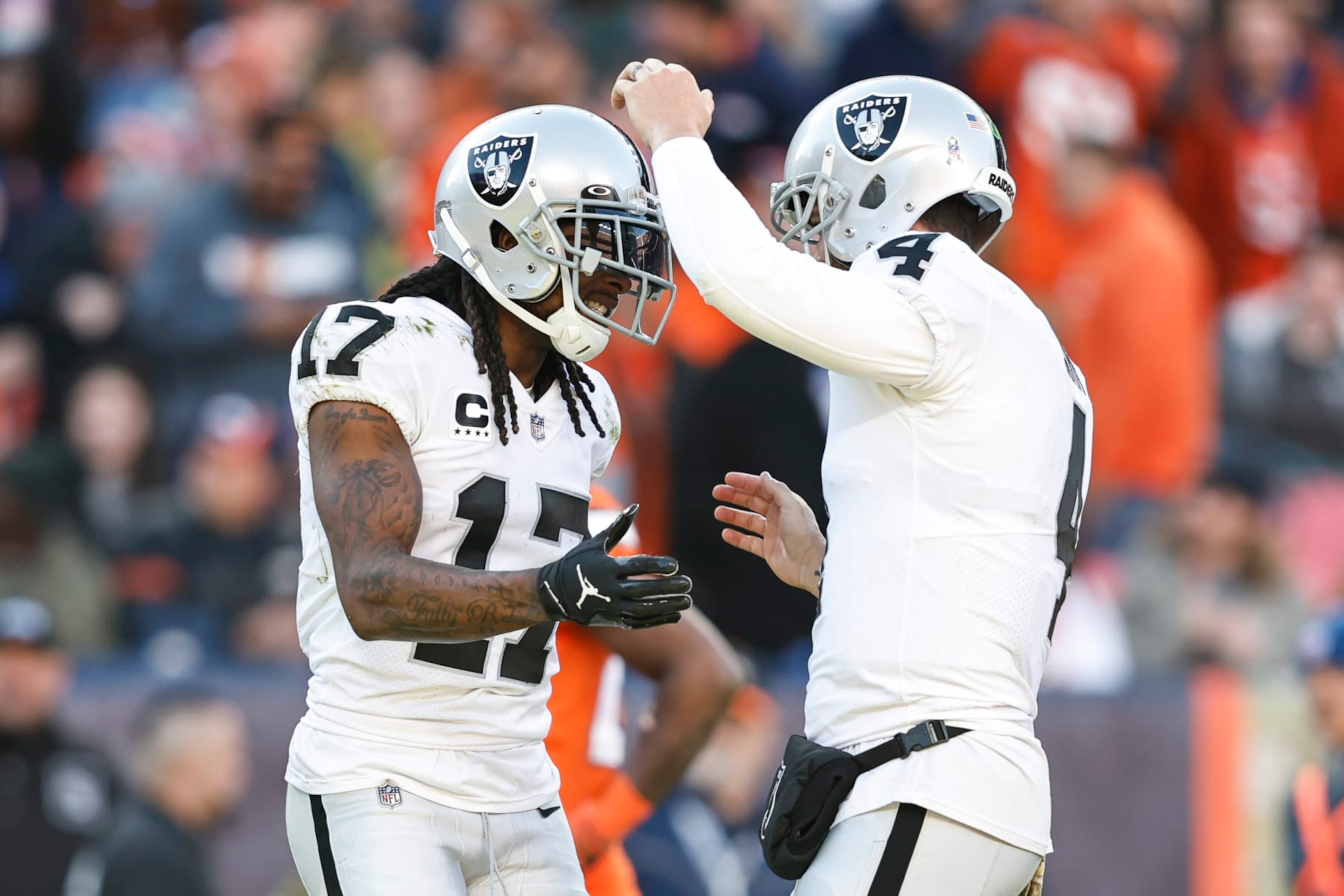 DENVER, COLORADO - NOVEMBER 20: Davante Adams #17 of the Las Vegas Raiders celebrates with Derek Carr #4 of the Las Vegas Raiders after completing a pass for a touchdown during an NFL game between the Las Vegas Raiders and Denver Broncos at Empower Field At Mile High on November 20, 2022 in Denver, Colorado. The Las Vegas Raiders won in overtime (Photo by Michael Owens/Getty Images)