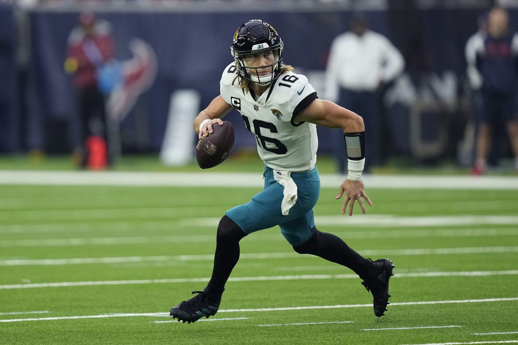 Jacksonville Jaguars quarterback Trevor Lawrence (16) looks to pass against the Houston Texans during the second half of an NFL football game in Houston, Sunday, Jan. 1, 2023. (AP Photo/David J. Phillip)