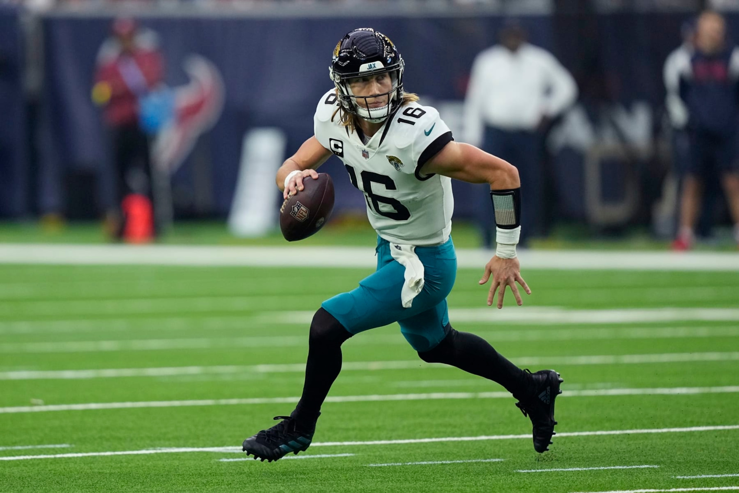Jacksonville Jaguars quarterback Trevor Lawrence (16) looks to pass against the Houston Texans during the second half of an NFL football game in Houston, Sunday, Jan. 1, 2023. (AP Photo/David J. Phillip) Jacksonville Jaguars quarterback Trevor Lawrence (16) looks to pass against the Houston Texans during the second half of an NFL football game in Houston, Sunday, Jan. 1, 2023. (AP Photo/David J. Phillip)