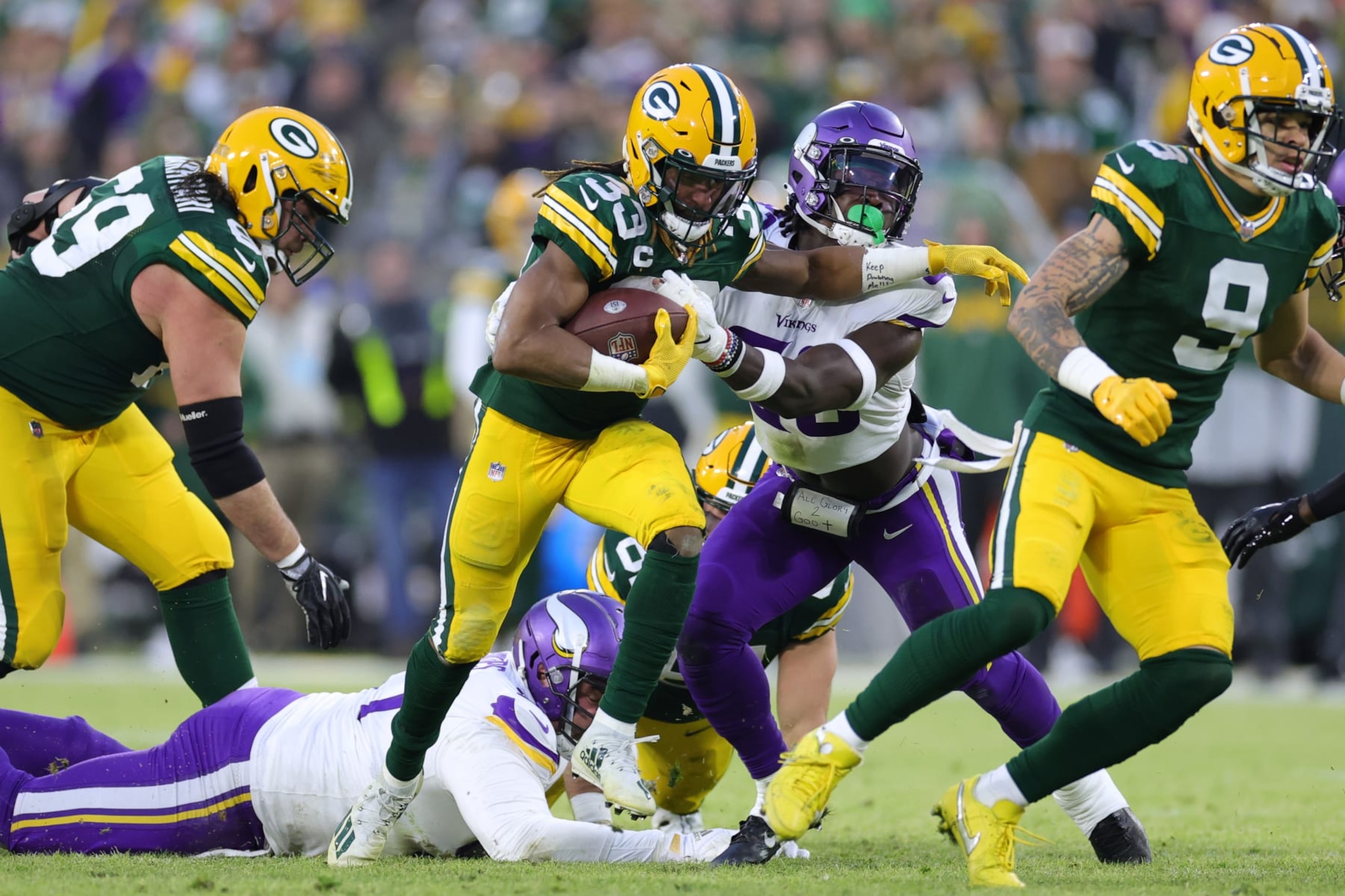 GREEN BAY, WISCONSIN - JANUARY 01: Aaron Jones #33 of the Green Bay Packers runs the ball for a first down during the second quarter against the Minnesota Vikings at Lambeau Field on January 01, 2023 in Green Bay, Wisconsin. (Photo by Stacy Revere/Getty Images) GREEN BAY, WISCONSIN - JANUARY 01: Aaron Jones #33 of the Green Bay Packers runs the ball for a first down during the second quarter against the Minnesota Vikings at Lambeau Field on January 01, 2023 in Green Bay, Wisconsin. (Photo by Stacy Revere/Getty Images)
