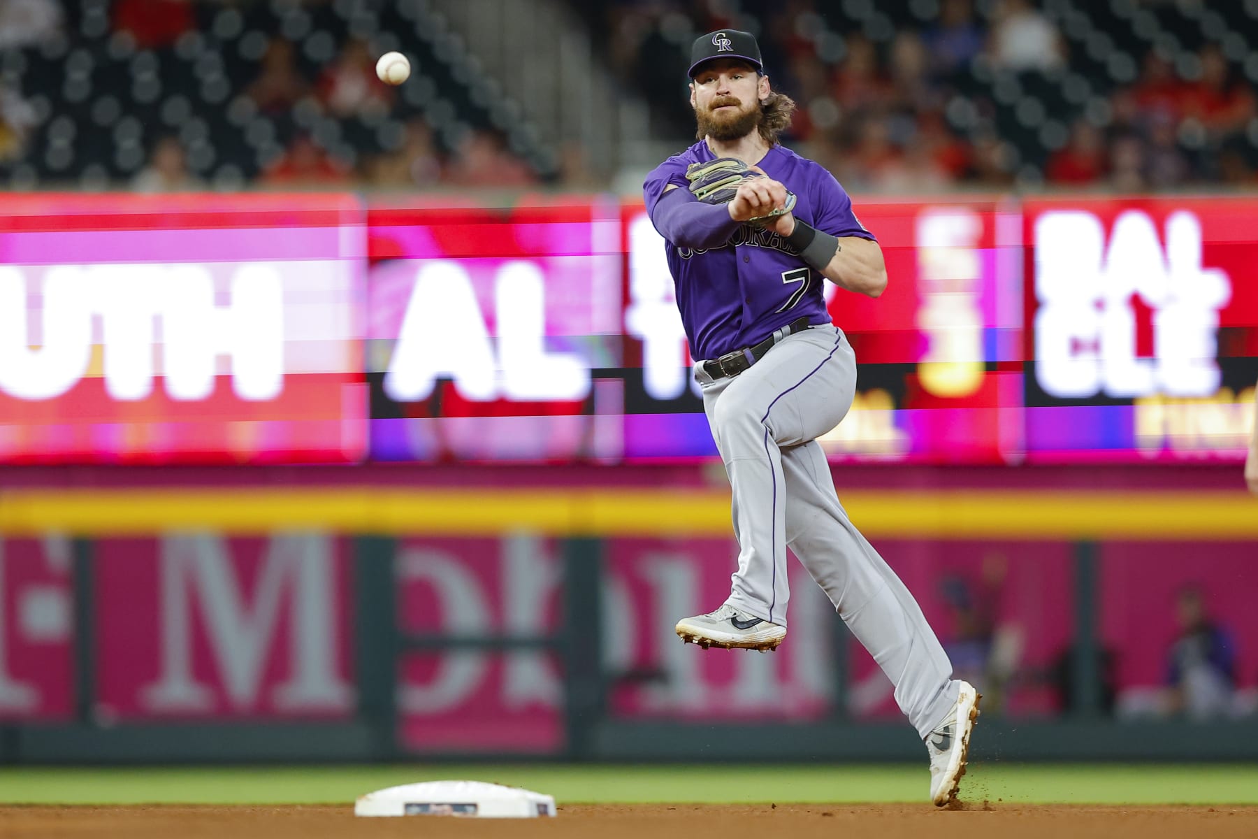 ATLANTA, GA - AUGUST 31: Brendan Rodgers #7 of the Colorado Rockies throws to first during the seventh inning against the Atlanta Braves at Truist Park on August 31, 2022 in Atlanta, Georgia. (Photo by Todd Kirkland/Getty Images)