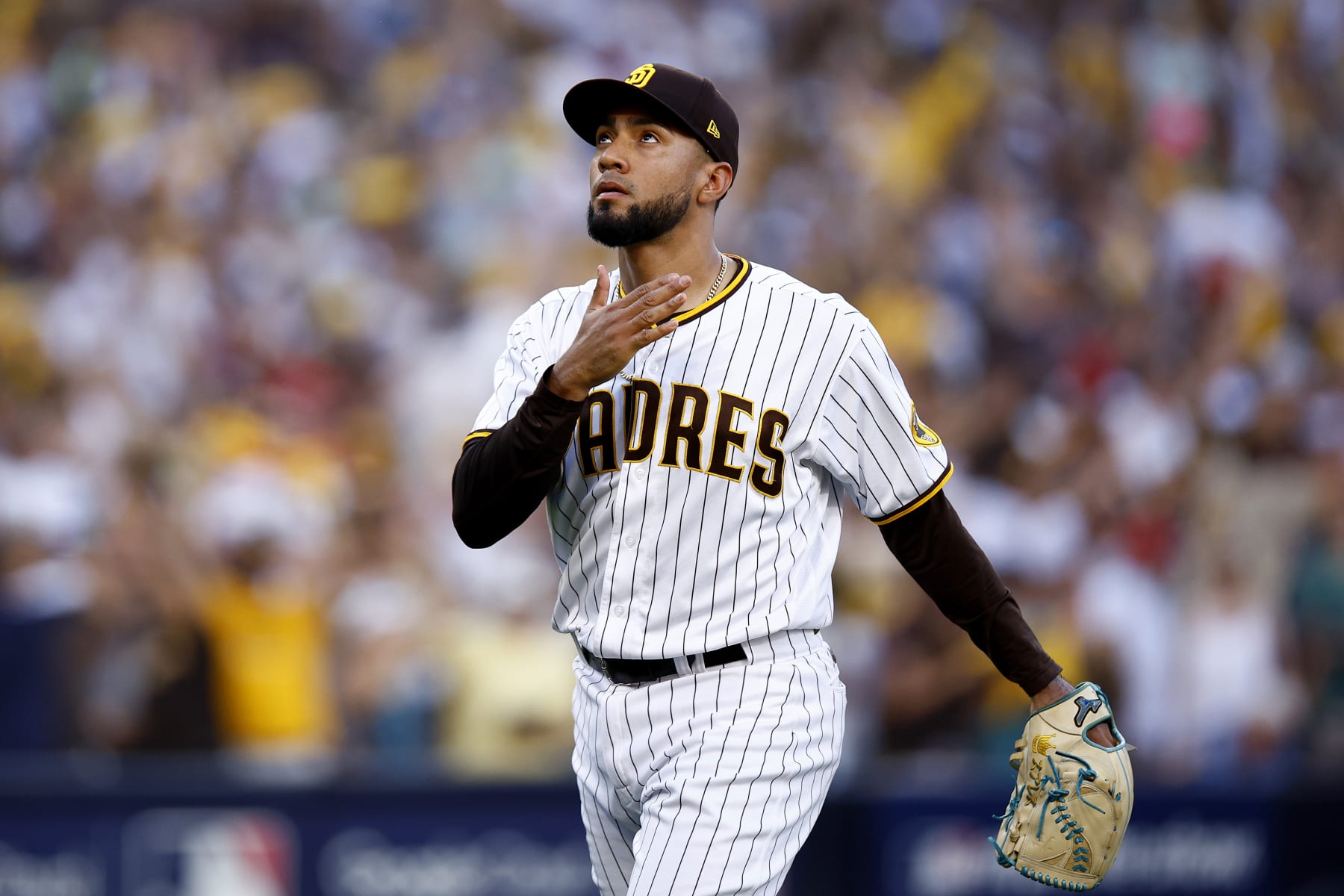 SAN DIEGO, CALIFORNIA - OCTOBER 19: Robert Suarez #75 of the San Diego Padres reacts as he walks back to the dugout after the top of the eighth inning against the Philadelphia Phillies in game two of the National League Championship Series at PETCO Park on October 19, 2022 in San Diego, California. (Photo by Ronald Martinez/Getty Images)