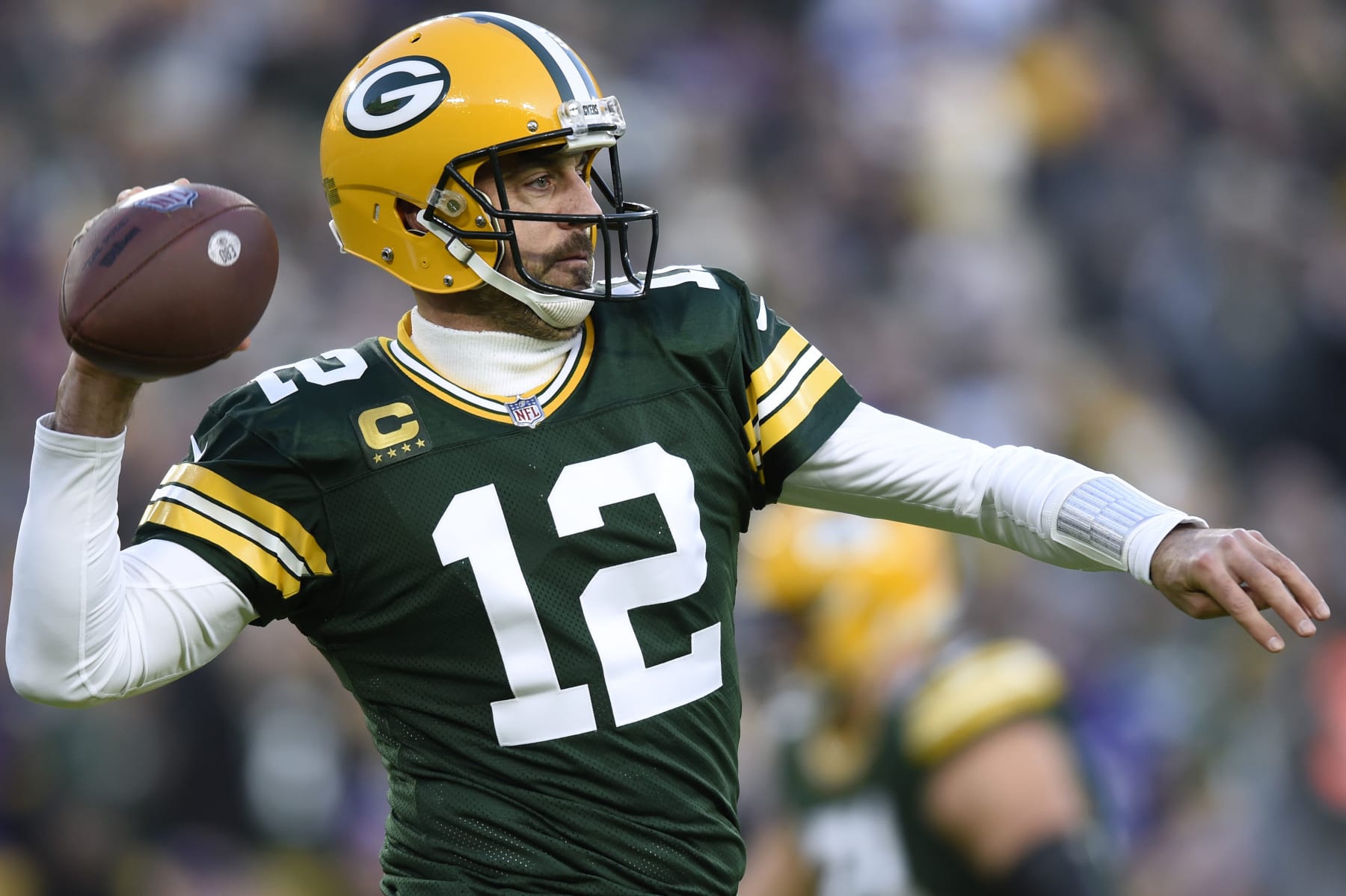 GREEN BAY, WISCONSIN - JANUARY 01: Aaron Rodgers #12 of the Green Bay Packers throws a pass during the first quarter against the Minnesota Vikings at Lambeau Field on January 01, 2023 in Green Bay, Wisconsin. (Photo by Kayla Wolf/Getty Images)
