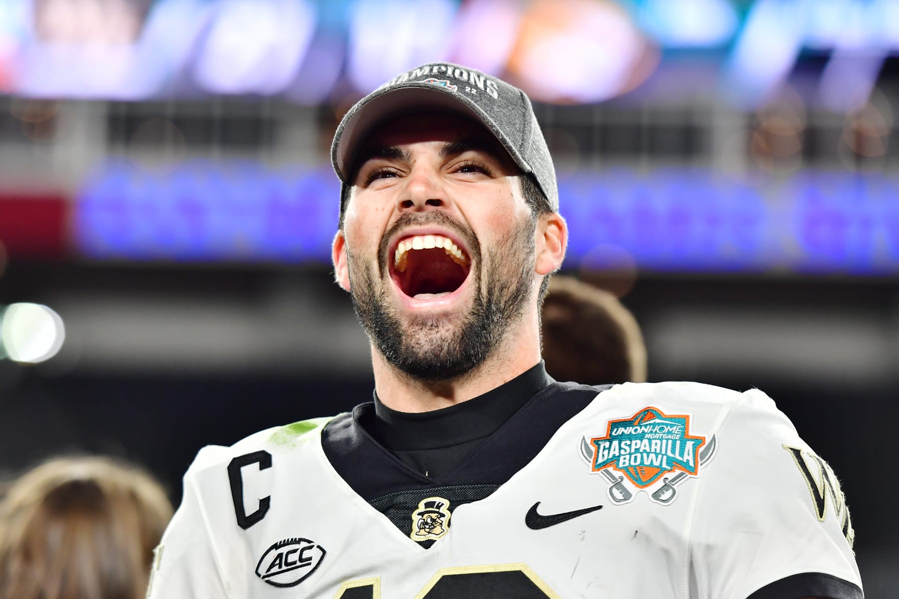 TAMPA, FLORIDA - DECEMBER 23: Sam Hartman #10 of the Wake Forest Demon Deacons reacts after defeating the Missouri Tigers 27-17 in the Union Home Mortgage Gasparilla Bowl at Raymond James Stadium on December 23, 2022 in Tampa, Florida. (Photo by Julio Aguilar/Getty Images)