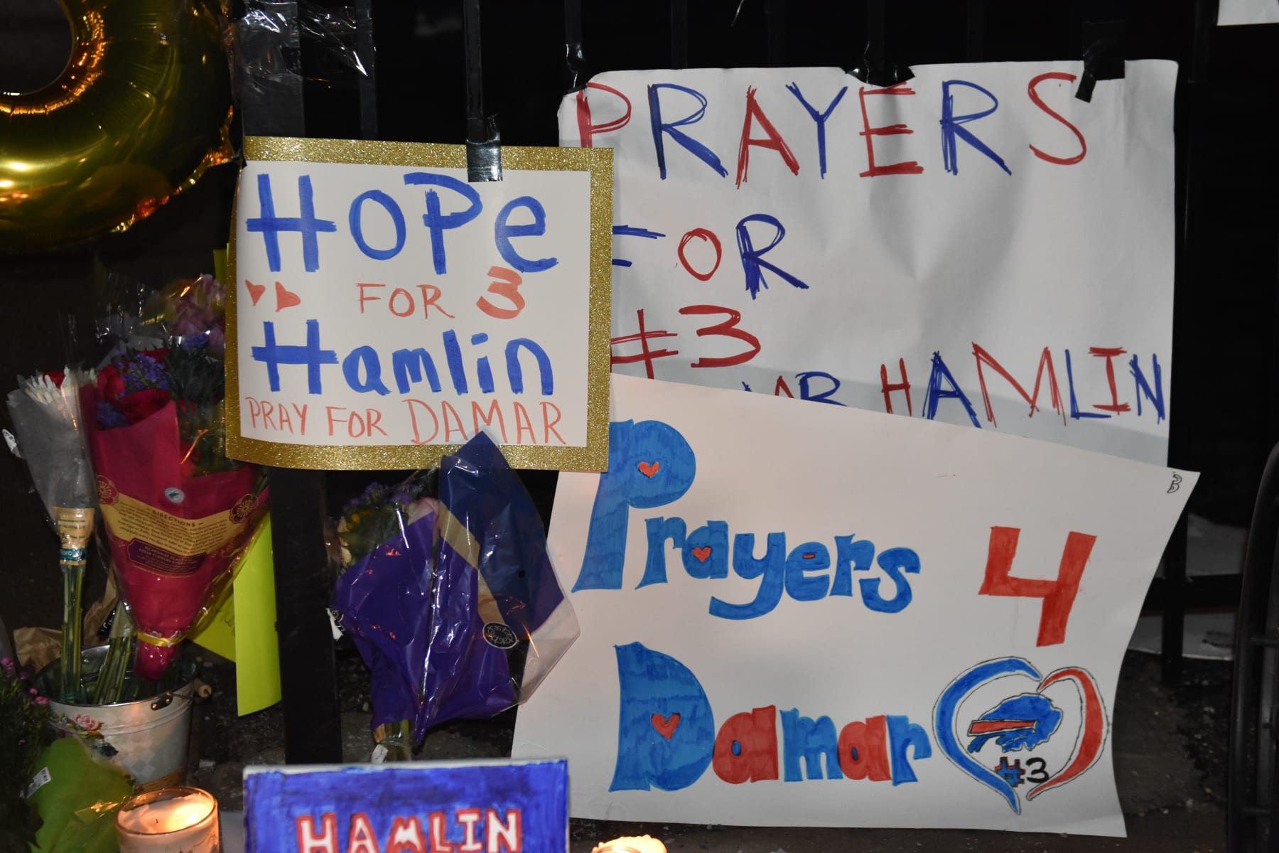 CINCINNATI, UNITED STATES - JANUARY 3: Fans gather outside the UC Medical Center for Damar Hamlin, a National Football League (NFL) player in the US, who receive medical attention after suffering from a "cardiac arrest." during a football game, in Cincinnati, United States on January 3, 2022. Damar Hamlin on Monday collapsed during a football game and is in a "critical condition." (Photo by Kyle Mazza/Anadolu Agency via Getty Images)