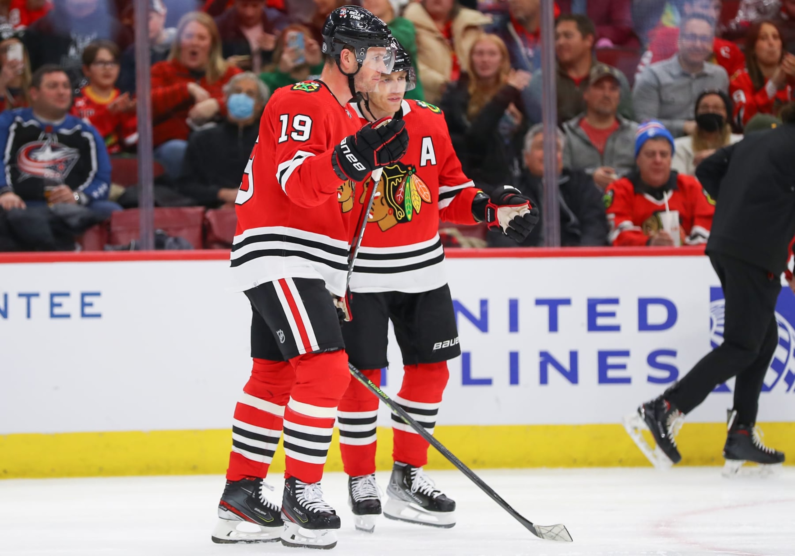 CHICAGO, IL - DECEMBER 23: Chicago Blackhawks Center Jonathan Toews (19) and Chicago Blackhawks Right Wing Patrick Kane (88) chat during a time out during a game between the Columbus Blue Jackets and the Chicago Blackhawks on December 23, 2022 at the United Center in Chicago, IL. (Photo by Melissa Tamez/Icon Sportswire via Getty Images)