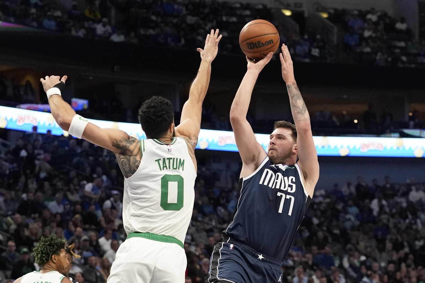 Dallas Mavericks guard Luka Doncic (77) shoots against Boston Celtics forward Jayson Tatum (0) during the first half of an NBA basketball game in Dallas, Thursday, Jan. 5, 2023. (AP Photo/LM Otero) Dallas Mavericks guard Luka Doncic (77) shoots against Boston Celtics forward Jayson Tatum (0) during the first half of an NBA basketball game in Dallas, Thursday, Jan. 5, 2023. (AP Photo/LM Otero)