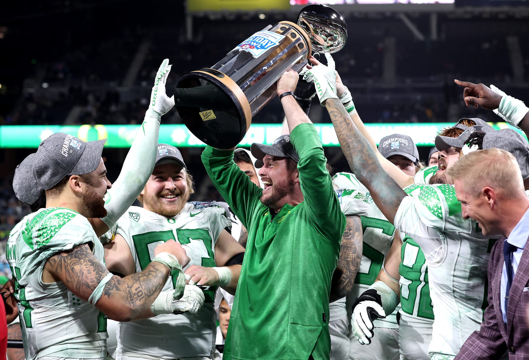 SAN DIEGO, CALIFORNIA - DECEMBER 28: Head coach Dan Lanning of the Oregon Ducks holds up the Holiday Bowl trophy after defeating the North Carolina Tar Heels 28-27 in the San Diego Credit Union Holiday Bowl game at PETCO Park on December 28, 2022 in San Diego, California. (Photo by Sean M. Haffey/Getty Images)