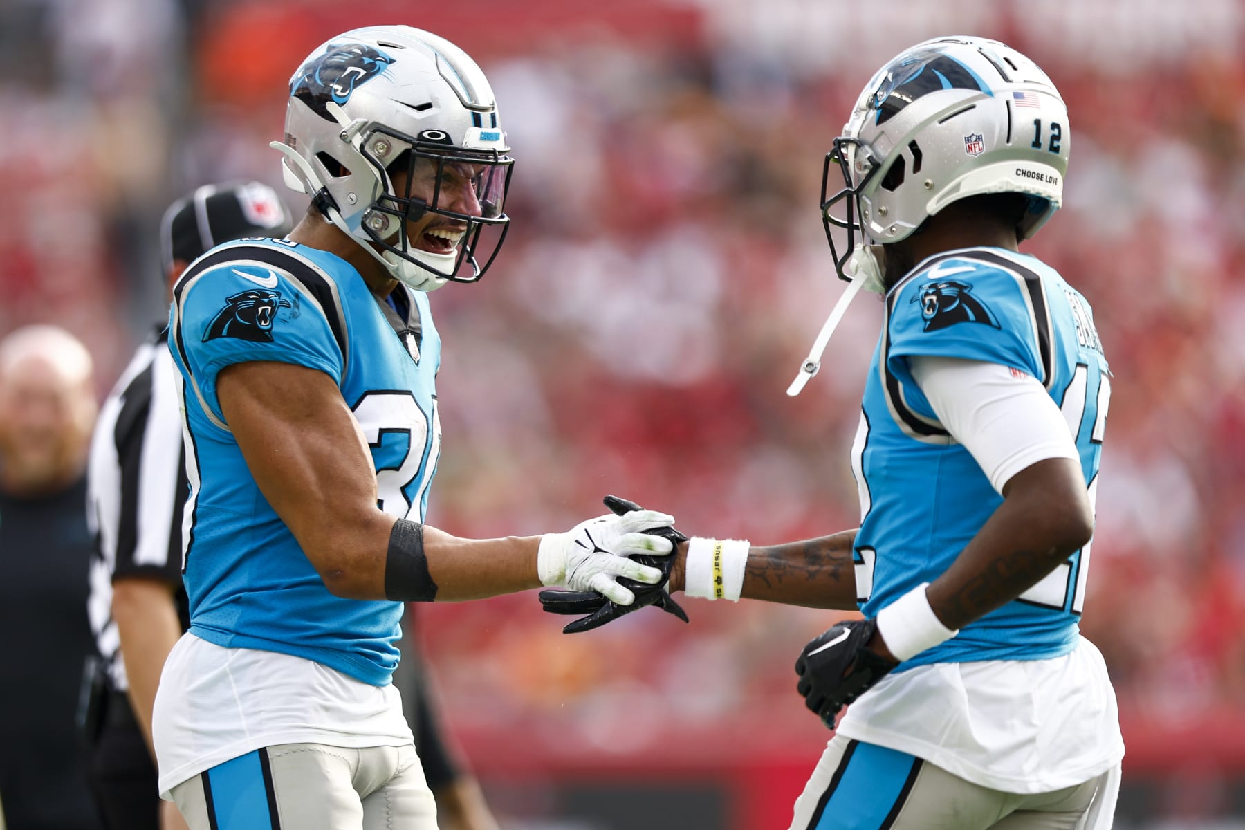 TAMPA, FL - JANUARY 1: Shi Smith #12 of the Carolina Panthers celebrates with Chuba Hubbard #30 after scoring a touchdown during the fourth quarter of an NFL football game against the Tampa Bay Buccaneers at Raymond James Stadium on January 1, 2023 in Tampa, Florida. (Photo by Kevin Sabitus/Getty Images)