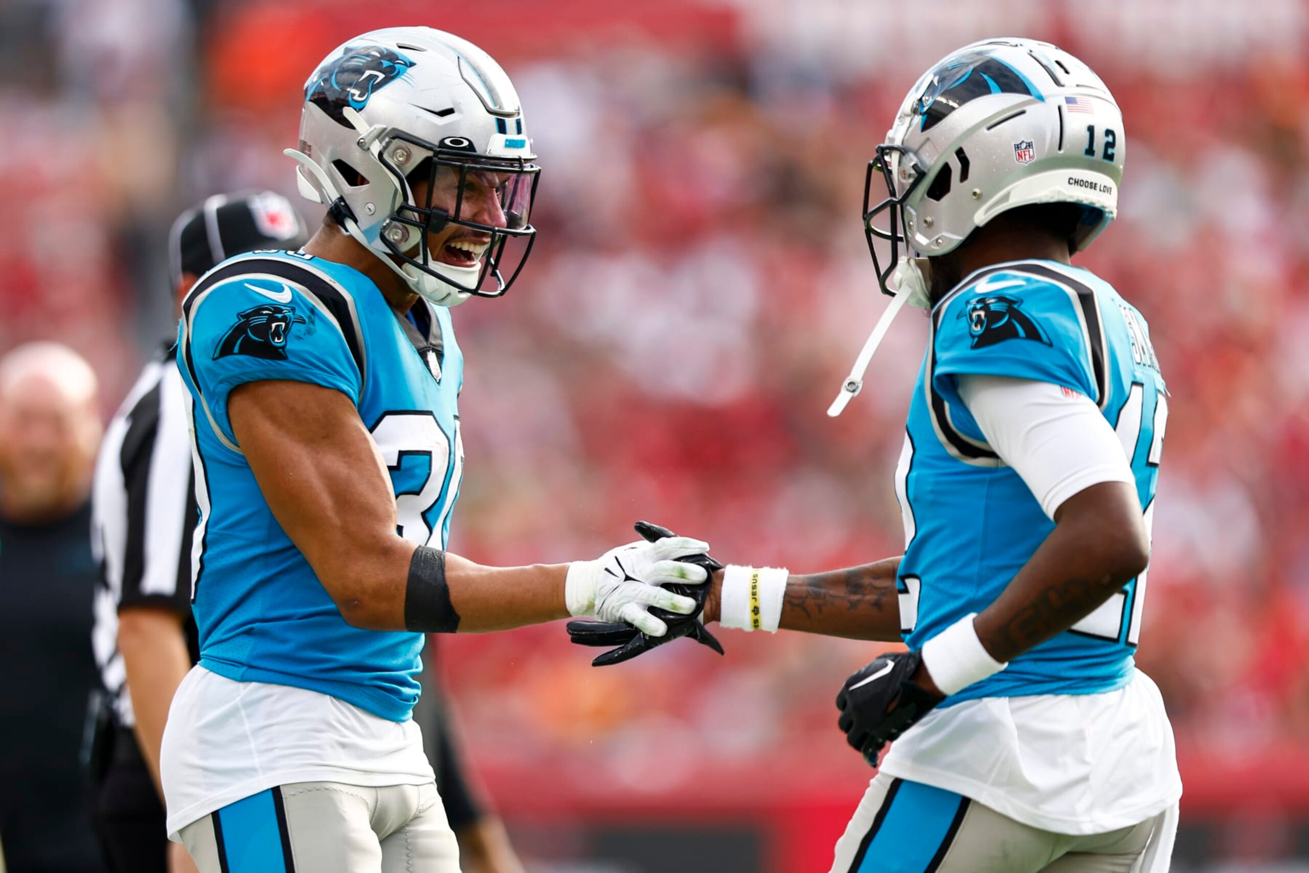 TAMPA, FL - JANUARY 1: Shi Smith #12 of the Carolina Panthers celebrates with Chuba Hubbard #30 after scoring a touchdown during the fourth quarter of an NFL football game against the Tampa Bay Buccaneers at Raymond James Stadium on January 1, 2023 in Tampa, Florida. (Photo by Kevin Sabitus/Getty Images)