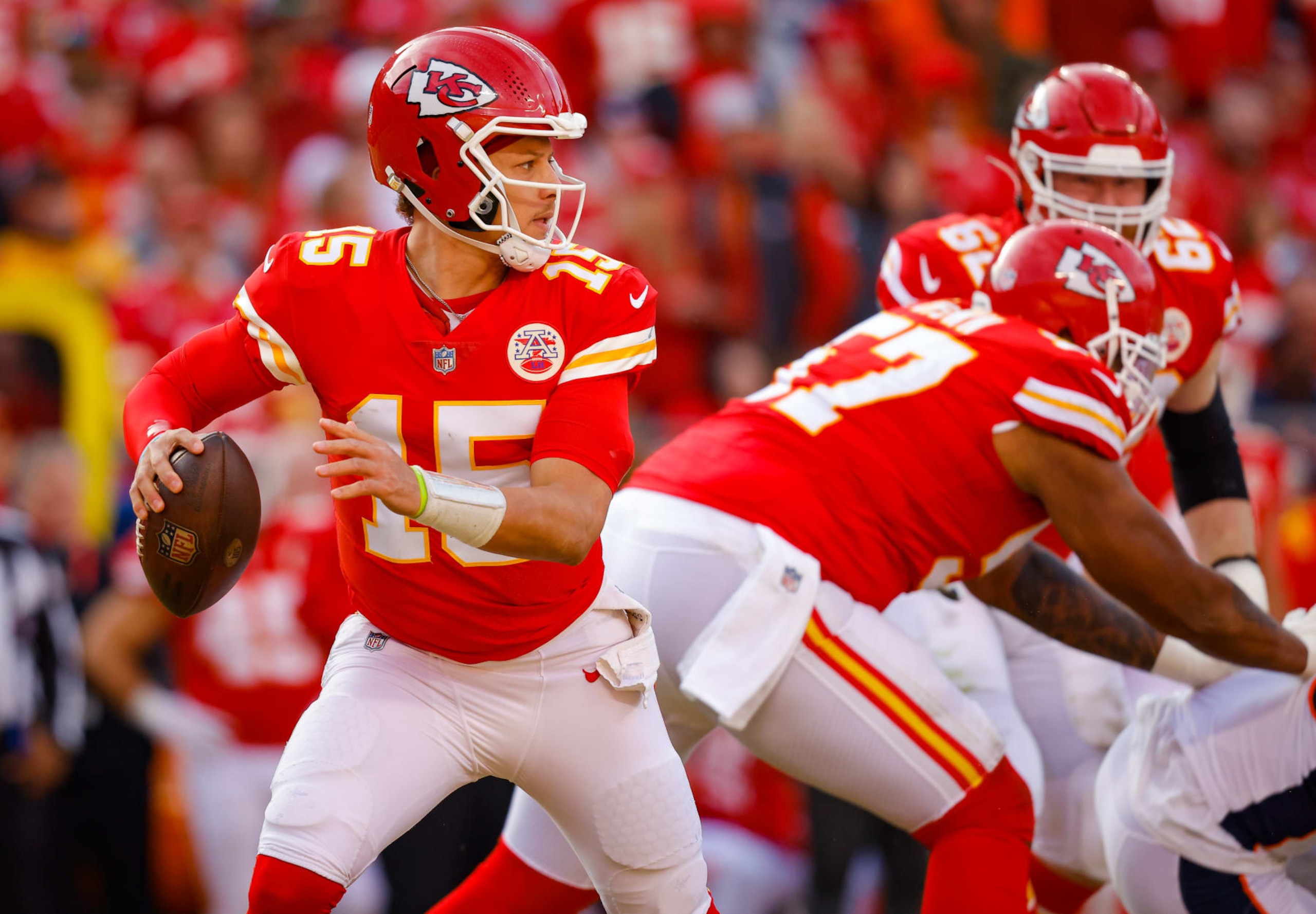 KANSAS CITY, MO - JANUARY 01: Patrick Mahomes #15 of the Kansas City Chiefs looks for an open receiver during the third quarter against the Denver Broncos at Arrowhead Stadium on January 1, 2023 in Kansas City, Missouri. (Photo by David Eulitt/Getty Images)