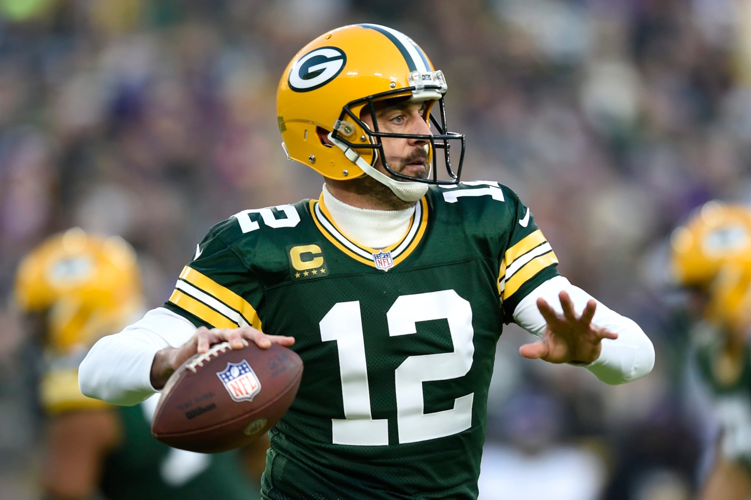 GREEN BAY, WISCONSIN - JANUARY 01: Aaron Rodgers #12 of the Green Bay Packers throws a pass during the first quarter against the Minnesota Vikings at Lambeau Field on January 01, 2023 in Green Bay, Wisconsin. (Photo by Kayla Wolf/Getty Images)