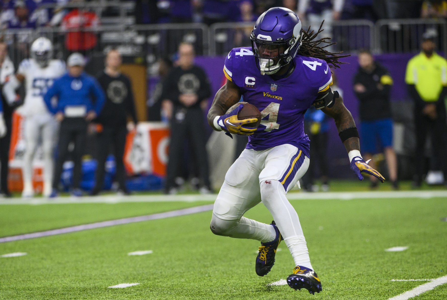 MINNEAPOLIS, MN - DECEMBER 17: Dalvin Cook #4 of the Minnesota Vikings runs with the ball in the fourth quarter of the game against the Indianapolis Colts at U.S. Bank Stadium on December 17, 2022 in Minneapolis, Minnesota. (Photo by Stephen Maturen/Getty Images)
