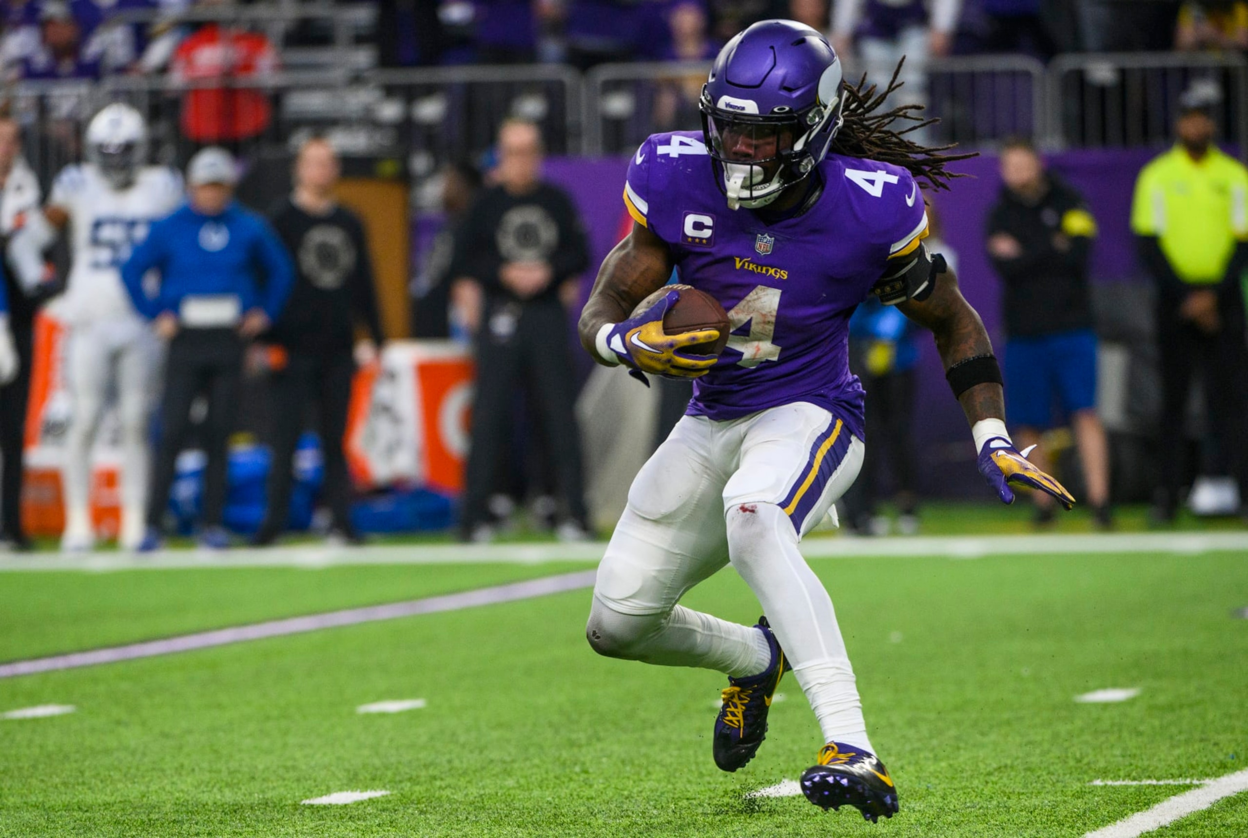 MINNEAPOLIS, MN - DECEMBER 17: Dalvin Cook #4 of the Minnesota Vikings runs with the ball in the fourth quarter of the game against the Indianapolis Colts at U.S. Bank Stadium on December 17, 2022 in Minneapolis, Minnesota. (Photo by Stephen Maturen/Getty Images)