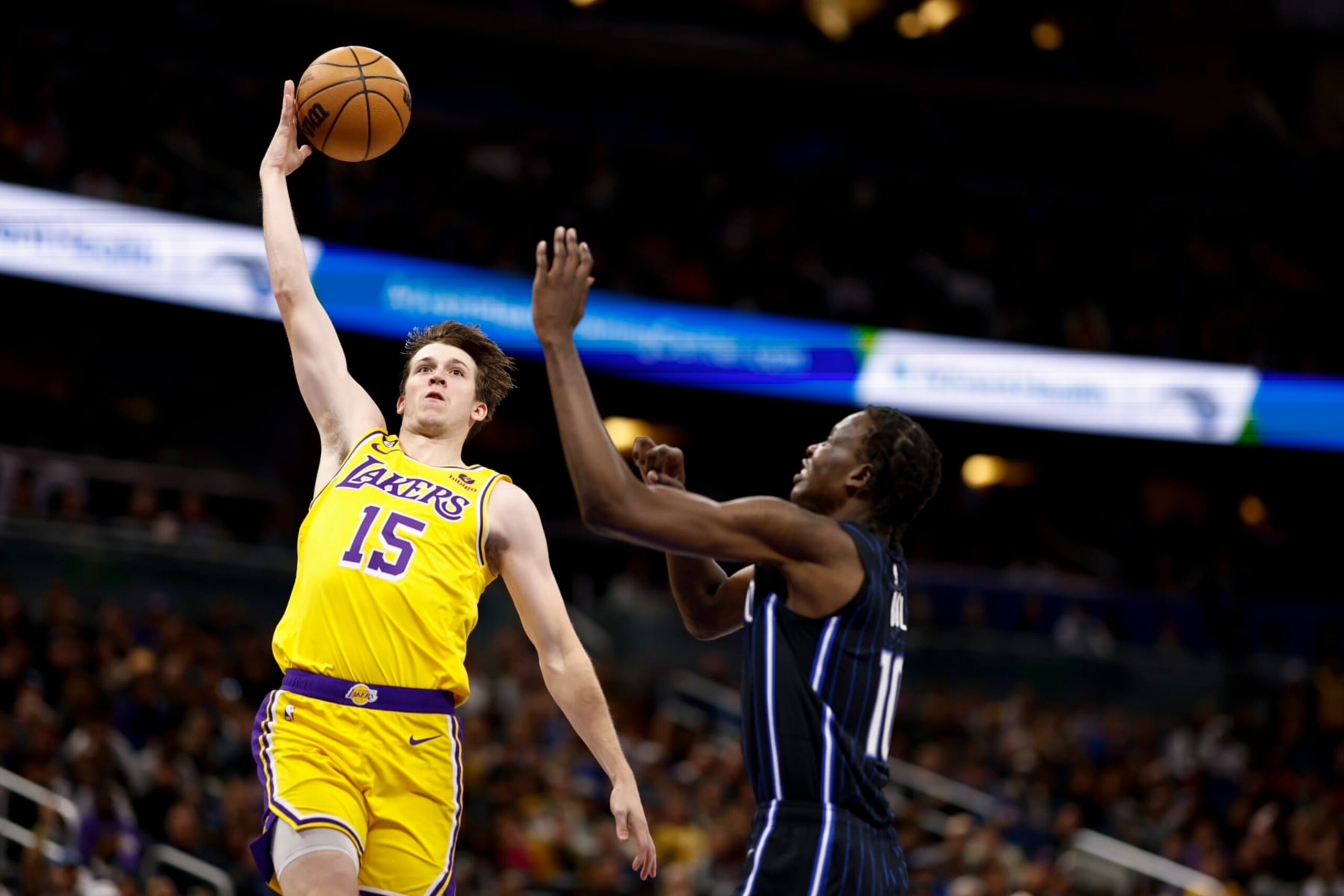 ORLANDO, FLORIDA - DECEMBER 27: Austin Reaves #15 of the Los Angeles Lakers passes the ball to LeBron James #6 against the Orlando Magic during the third quarter at Amway Center on December 27, 2022 in Orlando, Florida. NOTE TO USER: User expressly acknowledges and agrees that, by downloading and or using this photograph, User is consenting to the terms and conditions of the Getty Images License Agreement. (Photo by Douglas P. DeFelice/Getty Images) ORLANDO, FLORIDA - DECEMBER 27: Austin Reaves #15 of the Los Angeles Lakers passes the ball to LeBron James #6 against the Orlando Magic during the third quarter at Amway Center on December 27, 2022 in Orlando, Florida. NOTE TO USER: User expressly acknowledges and agrees that, by downloading and or using this photograph, User is consenting to the terms and conditions of the Getty Images License Agreement. (Photo by Douglas P. DeFelice/Getty Images)