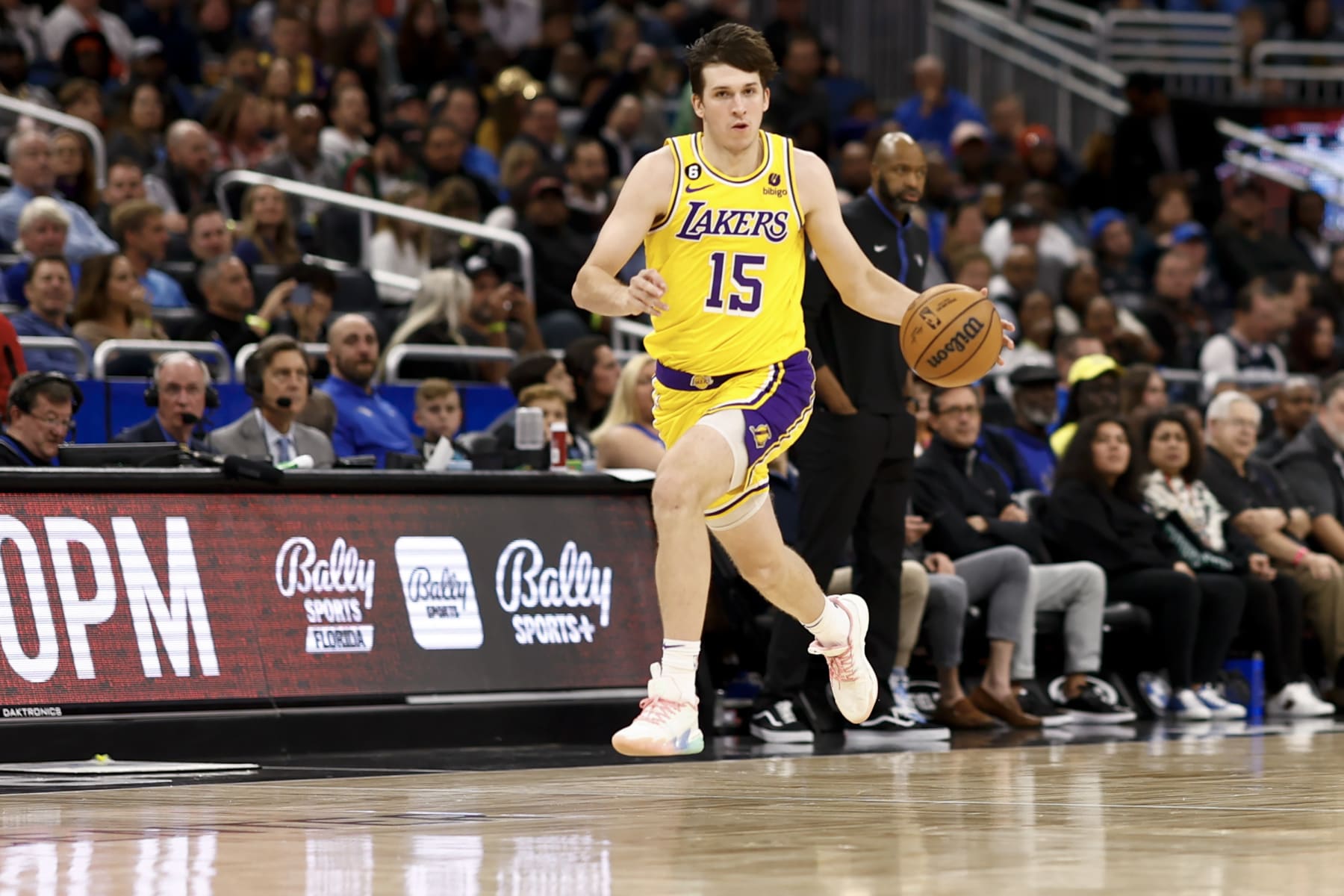 ORLANDO, FLORIDA - DECEMBER 27: Austin Reaves #15 of the Los Angeles Lakers dribbles the ball against the Orlando Magic during the third quarter at Amway Center on December 27, 2022 in Orlando, Florida. NOTE TO USER: User expressly acknowledges and agrees that, by downloading and or using this photograph, User is consenting to the terms and conditions of the Getty Images License Agreement. (Photo by Douglas P. DeFelice/Getty Images)