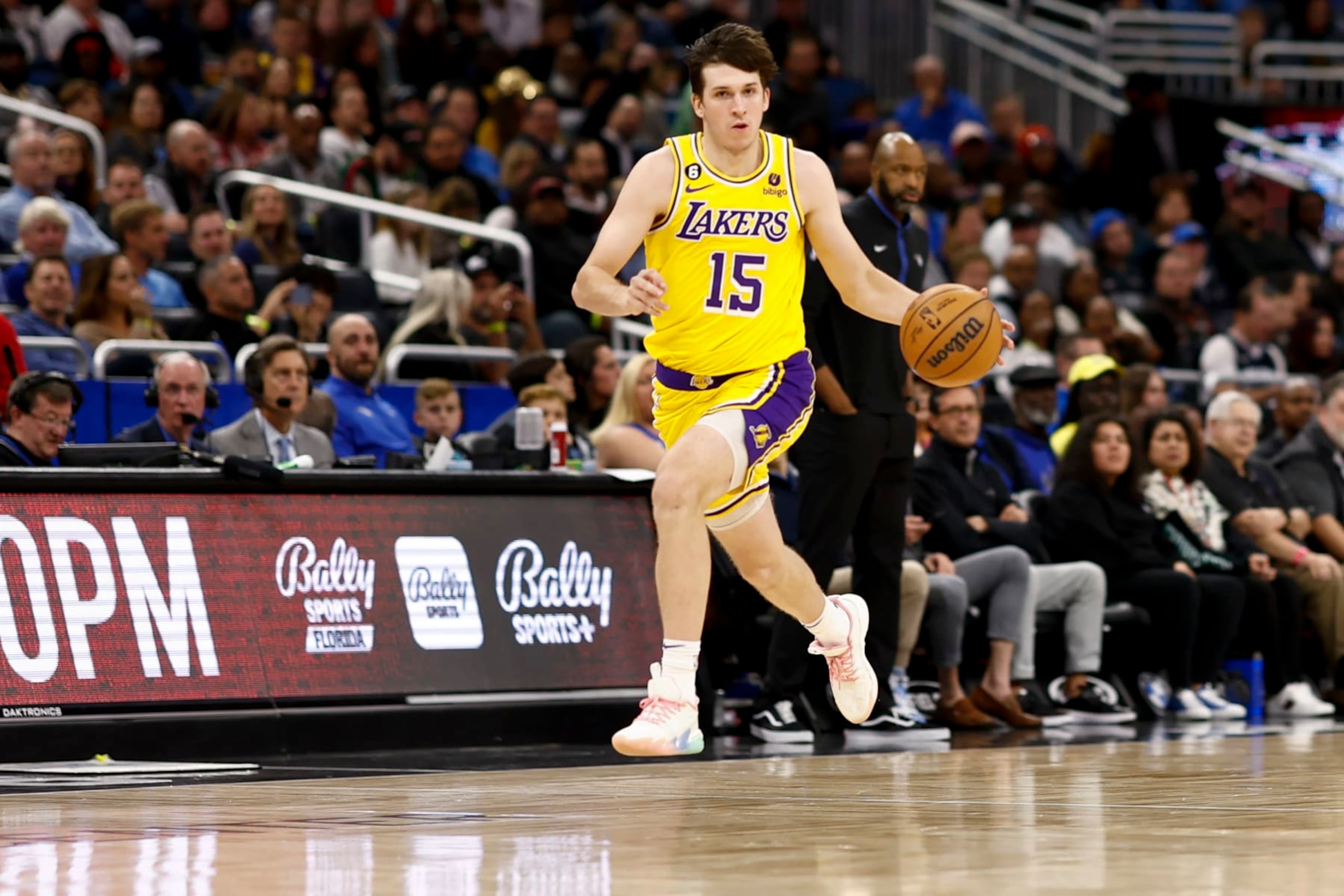 ORLANDO, FLORIDA - DECEMBER 27: Austin Reaves #15 of the Los Angeles Lakers dribbles the ball against the Orlando Magic during the third quarter at Amway Center on December 27, 2022 in Orlando, Florida. NOTE TO USER: User expressly acknowledges and agrees that, by downloading and or using this photograph, User is consenting to the terms and conditions of the Getty Images License Agreement. (Photo by Douglas P. DeFelice/Getty Images)