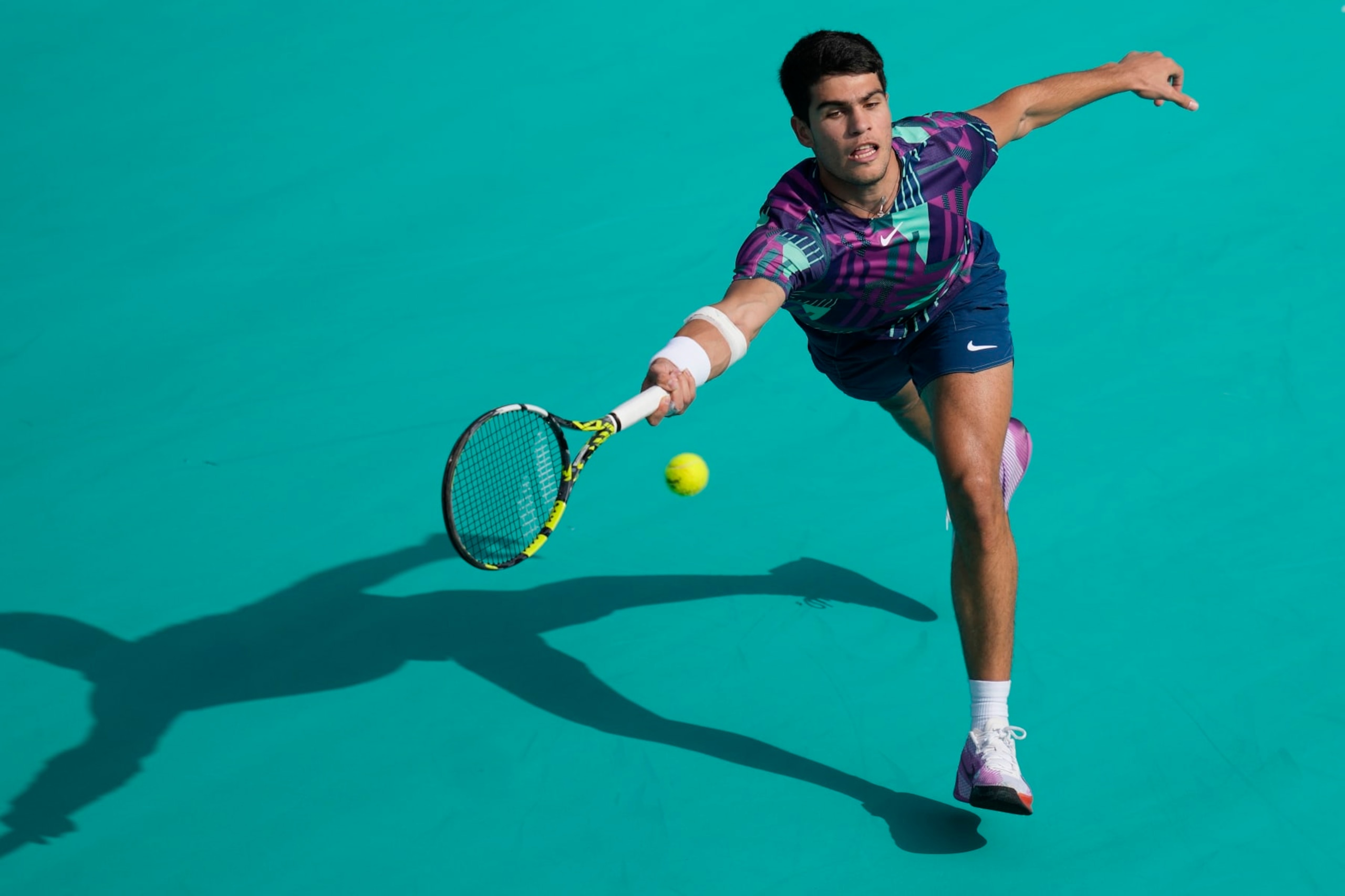 Carlos Alcaraz of Spain Casper returns the ball to Ruud of Norway, during a match for the third place of the Mubadala World Tennis Championship, in Abu Dhabi, United Arab Emirates, Sunday, Dec. 18, 2022. (AP Photo/Kamran Jebreili) Carlos Alcaraz of Spain Casper returns the ball to Ruud of Norway, during a match for the third place of the Mubadala World Tennis Championship, in Abu Dhabi, United Arab Emirates, Sunday, Dec. 18, 2022. (AP Photo/Kamran Jebreili)