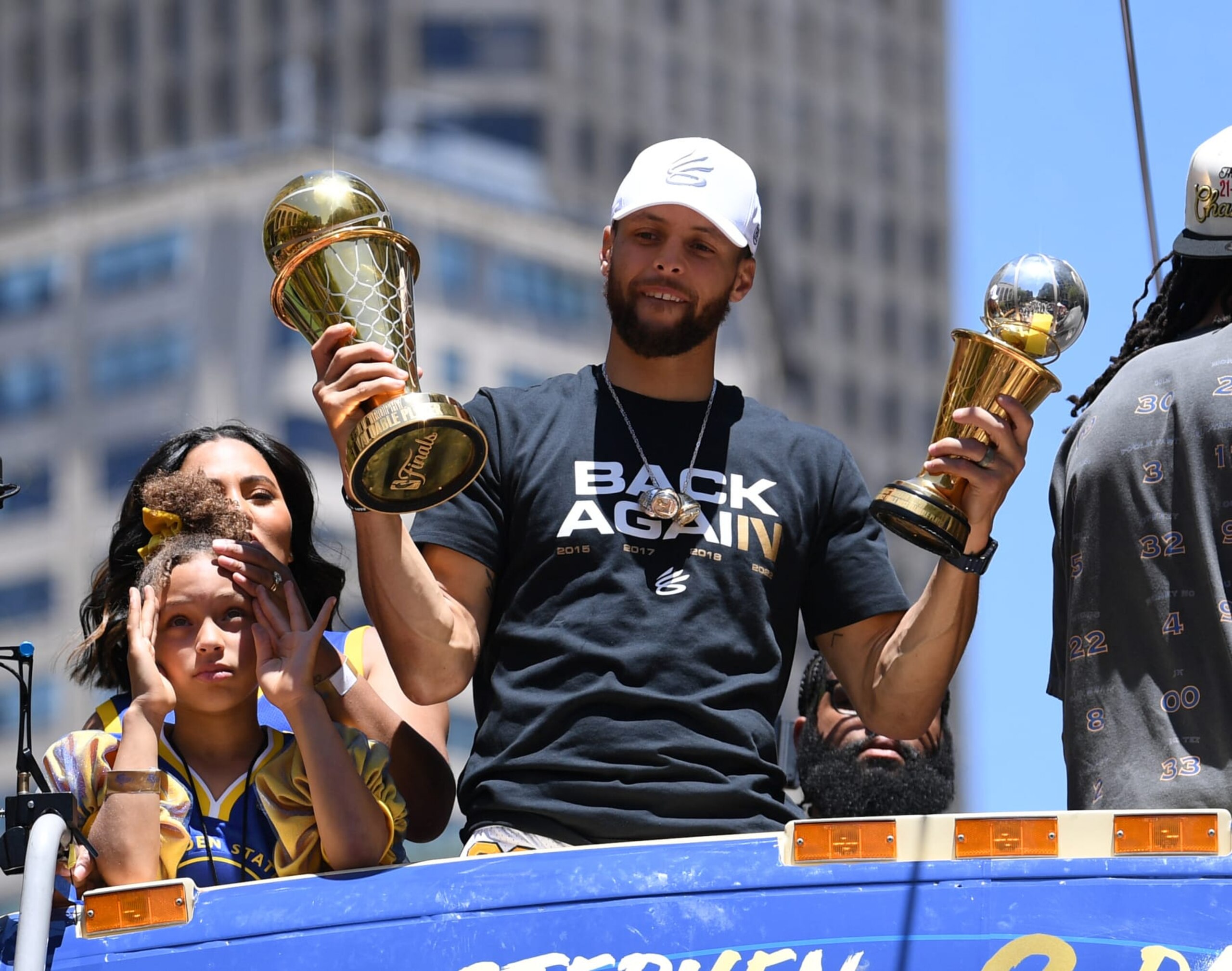 SAN FRANCISCO, CALIFORNIA - JUNE 20: Stephen Curry #30 of the Golden State Warriors, his wife Ayesha, and daughter Riley celebrate with his NBA Finals Most Valuable Player Award during the Victory Parade on June 20, 2022 in San Francisco, California. The Golden State Warriors beat the Boston Celtics 4-2 to win the 2022 NBA Finals. NOTE TO USER: User expressly acknowledges and agrees that, by downloading and or using this photograph, User is consenting to the terms and conditions of the Getty Images License Agreement. (Photo by Michael Urakami/Getty Images) SAN FRANCISCO, CALIFORNIA - JUNE 20: Stephen Curry #30 of the Golden State Warriors, his wife Ayesha, and daughter Riley celebrate with his NBA Finals Most Valuable Player Award during the Victory Parade on June 20, 2022 in San Francisco, California. The Golden State Warriors beat the Boston Celtics 4-2 to win the 2022 NBA Finals. NOTE TO USER: User expressly acknowledges and agrees that, by downloading and or using this photograph, User is consenting to the terms and conditions of the Getty Images License Agreement. (Photo by Michael Urakami/Getty Images)