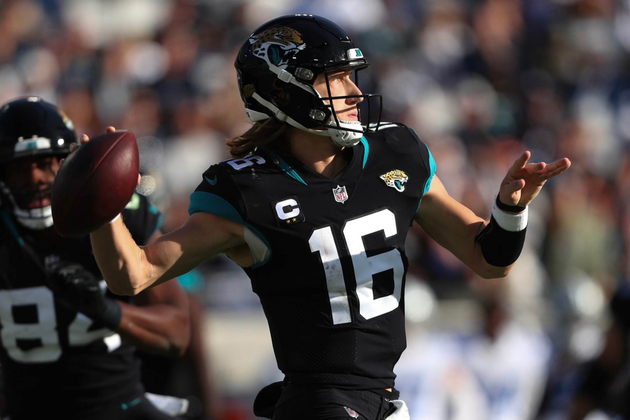 JACKSONVILLE, FLORIDA - DECEMBER 18: Trevor Lawrence #16 of the Jacksonville Jaguars throws a pass during the second half against the Dallas Cowboys at TIAA Bank Field on December 18, 2022 in Jacksonville, Florida. (Photo by Courtney Culbreath/Getty Images)