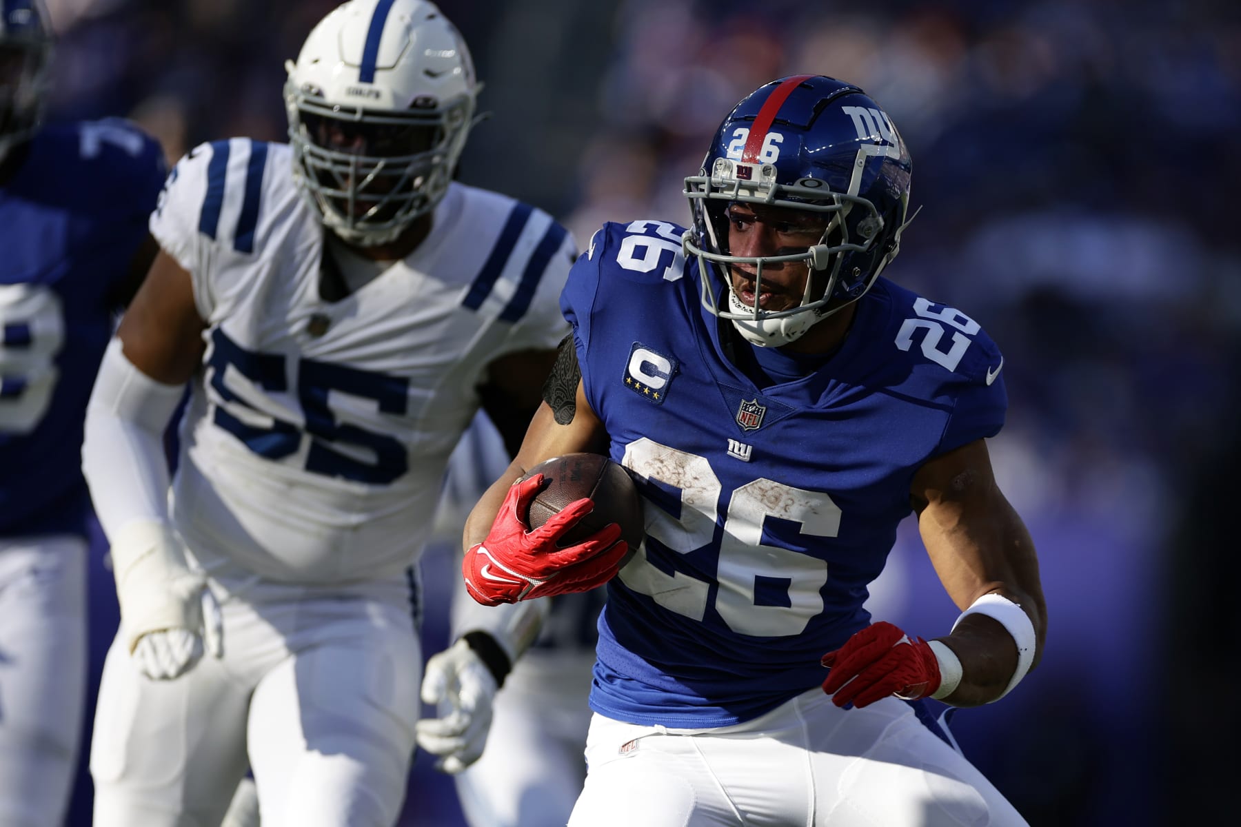 New York Giants running back Saquon Barkley (26) runs with the ball against the Indianapolis Colts during an NFL football game Sunday, Jan. 1, 2023, in East Rutherford, N.J. (AP Photo/Adam Hunger)