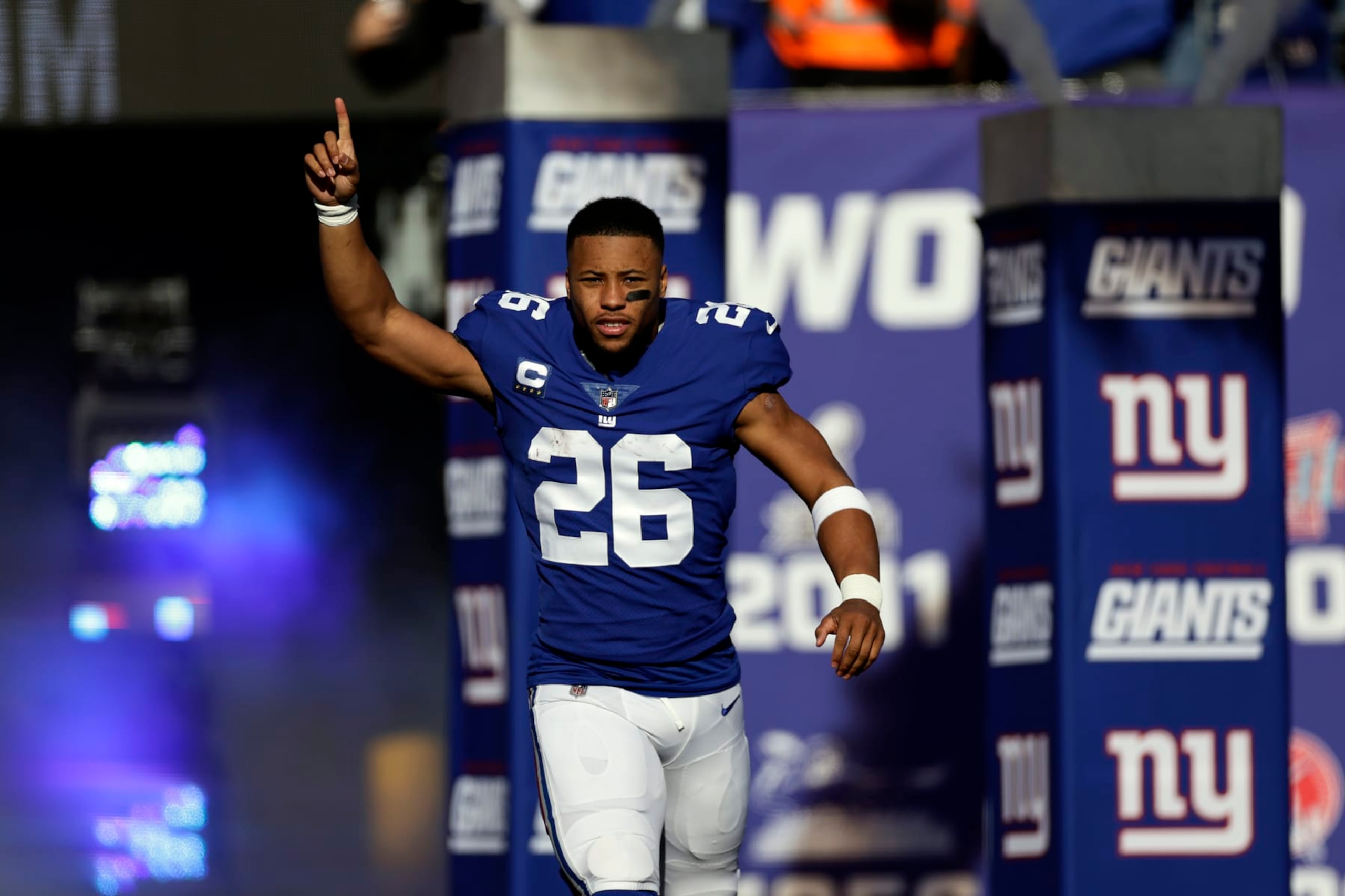New York Giants running back Saquon Barkley (26) is introduced before an NFL football game against the Indianapolis Colts on Sunday, Jan. 1, 2023, in East Rutherford, N.J. (AP Photo/Adam Hunger)