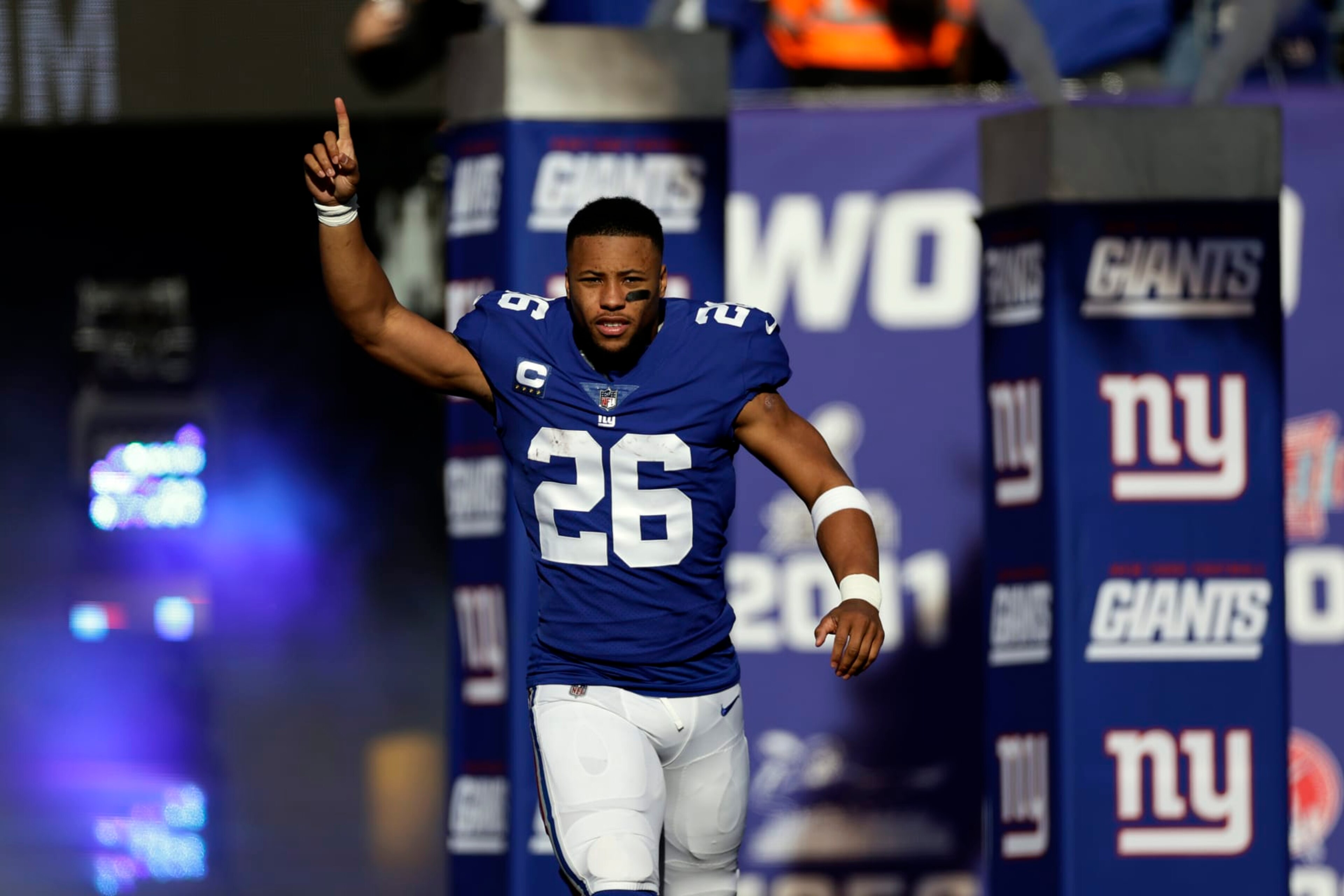 New York Giants running back Saquon Barkley (26) is introduced before an NFL football game against the Indianapolis Colts on Sunday, Jan. 1, 2023, in East Rutherford, N.J. (AP Photo/Adam Hunger) New York Giants running back Saquon Barkley (26) is introduced before an NFL football game against the Indianapolis Colts on Sunday, Jan. 1, 2023, in East Rutherford, N.J. (AP Photo/Adam Hunger)