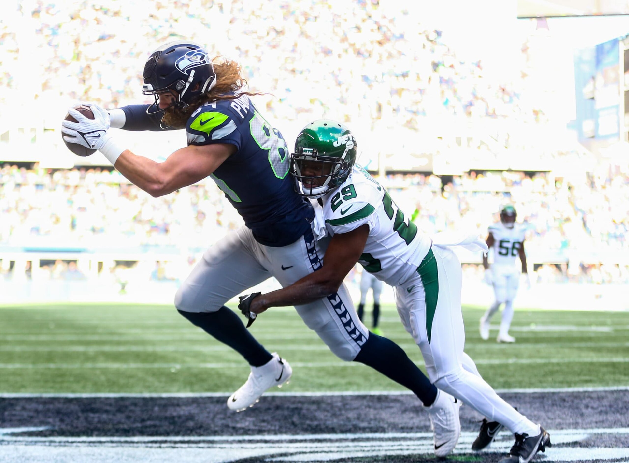 SEATTLE, WA - JANUARY 01:  Colby Parkinson #84 of the Seattle Seahawks catches a touchdown against Lamarcus Joyner #29 of the New York Jets during the first half of the game at Lumen Field on January 1, 2023 in Seattle, Washington. The Seahawks won 23-6.  (Photo by Lindsey Wasson/Getty Images)