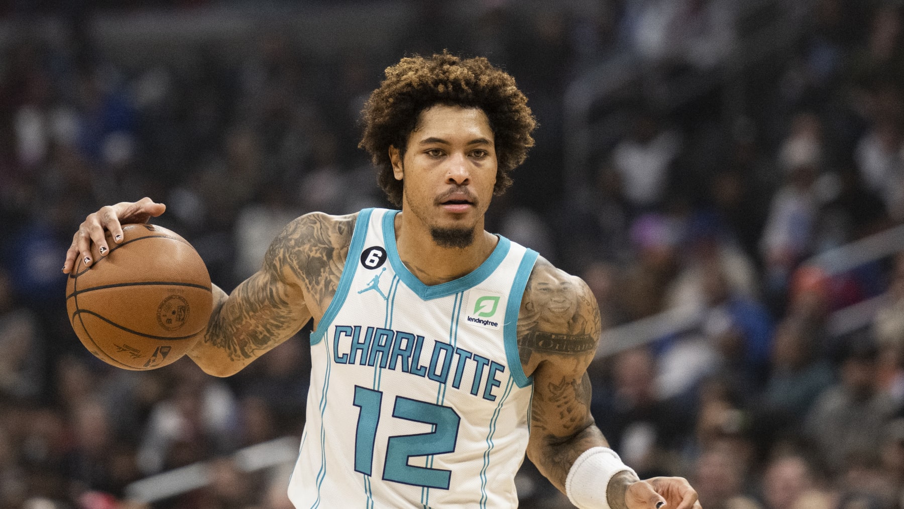 Charlotte Hornets guard Kelly Oubre Jr. (12) handles the ball during the first half of an NBA basketball game against the Los Angeles Clippers in Los Angeles Wednesday, Dec. 21, 2022. (AP Photo/Kyusung Gong)