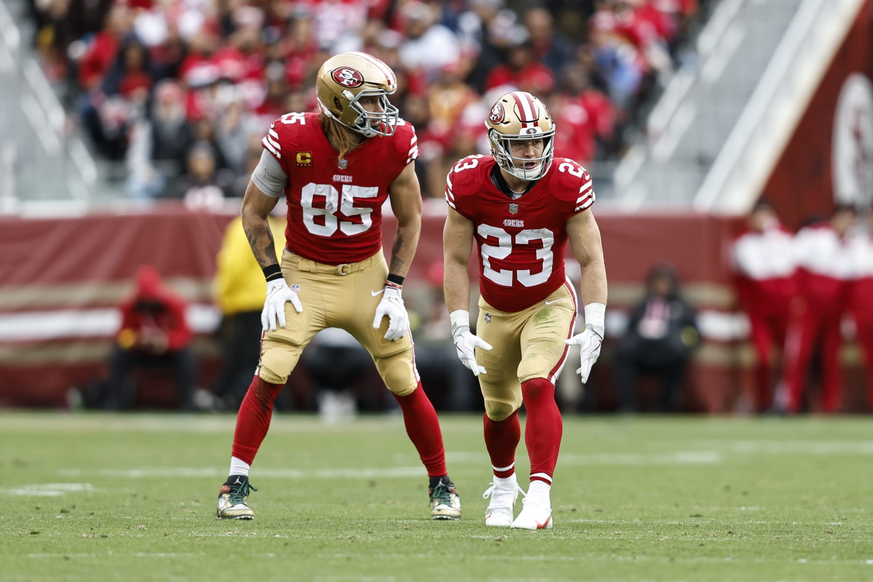SANTA CLARA, CALIFORNIA - DECEMBER 11: Christian McCaffrey #23 of the San Francisco 49ers and George Kittle #85 of the San Francisco 49ers line up during an NFL football game between the San Francisco 49ers and the Tampa Bay Buccaneers at Levi's Stadium on December 11, 2022 in Santa Clara, California. (Photo by Michael Owens/Getty Images)