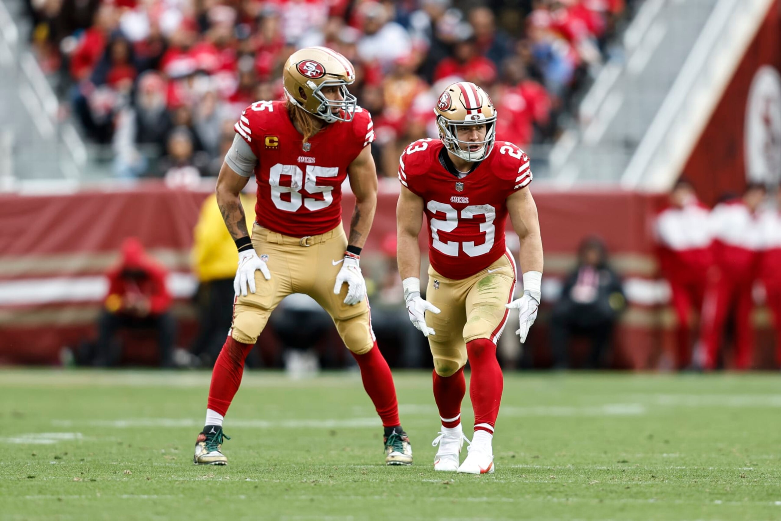 SANTA CLARA, CALIFORNIA - DECEMBER 11: Christian McCaffrey #23 of the San Francisco 49ers and George Kittle #85 of the San Francisco 49ers line up during an NFL football game between the San Francisco 49ers and the Tampa Bay Buccaneers at Levi's Stadium on December 11, 2022 in Santa Clara, California. (Photo by Michael Owens/Getty Images)