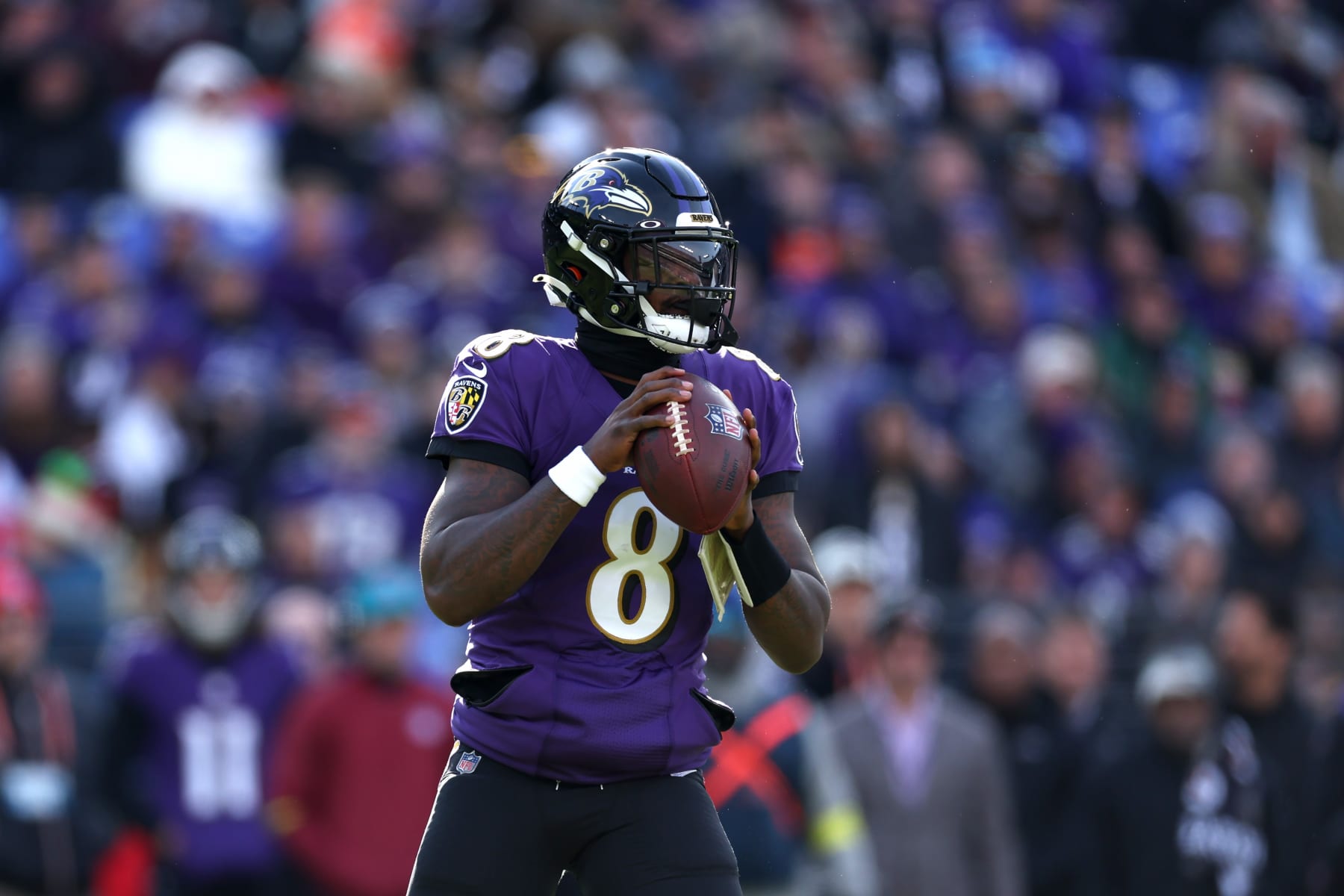BALTIMORE, MARYLAND - DECEMBER 04: Quarterback Lamar Jackson #8 of the Baltimore Ravens drops back to pass against the Denver Broncos at M&T Bank Stadium on December 04, 2022 in Baltimore, Maryland. (Photo by Rob Carr/Getty Images)