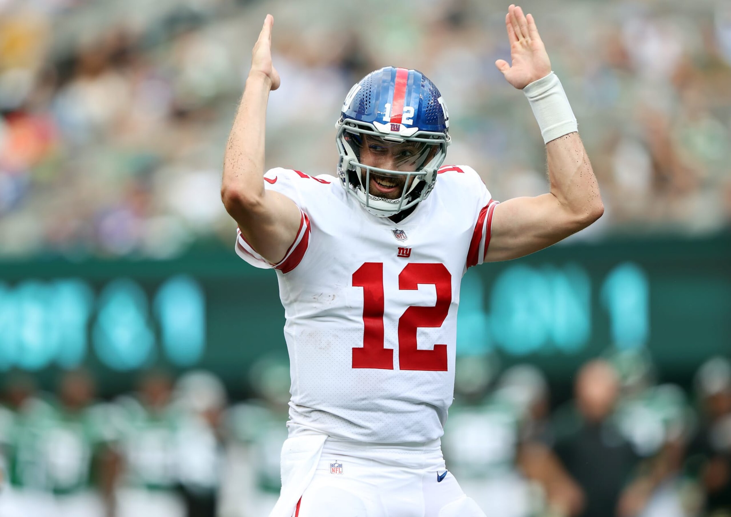 EAST RUTHERFORD, NEW JERSEY - AUGUST 28:  Quarterback Davis Webb #12 of the New York Giants celebrates after a touchdown during the preseason game against the New York Jets at MetLife Stadium on August 28, 2022 in East Rutherford, New Jersey. (Photo by Jamie Squire/Getty Images)