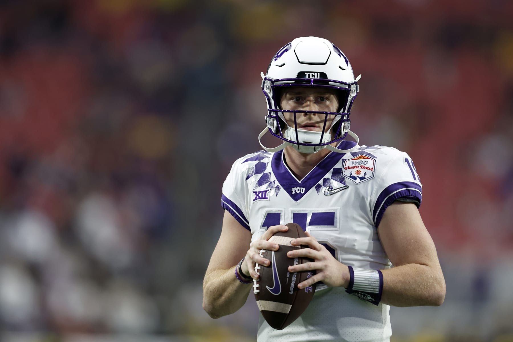 GLENDALE, ARIZONA - DECEMBER 31: Quarterback Max Duggan #15 of the TCU Horned Frogs warms up before the Vrbo Fiesta Bowl against the Michigan Wolverines at State Farm Stadium on December 31, 2022 in Glendale, Arizona. The Horned Frogs defeated the Wolverines 51-45. (Photo by Chris Coduto/Getty Images)