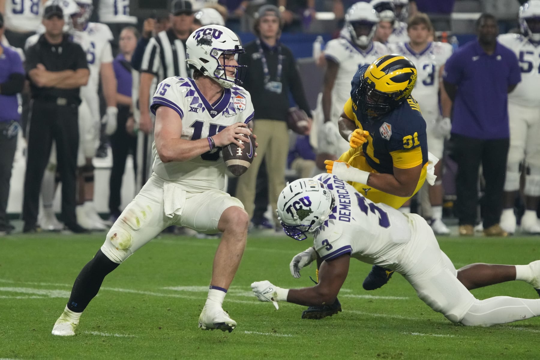 TCU quarterback Max Duggan (15) during the first half of the Fiesta Bowl NCAA college football semifinal playoff game against Michigan, Saturday, Dec. 31, 2022, in Glendale, Arizona. (AP Photo/Rick Scuteri)